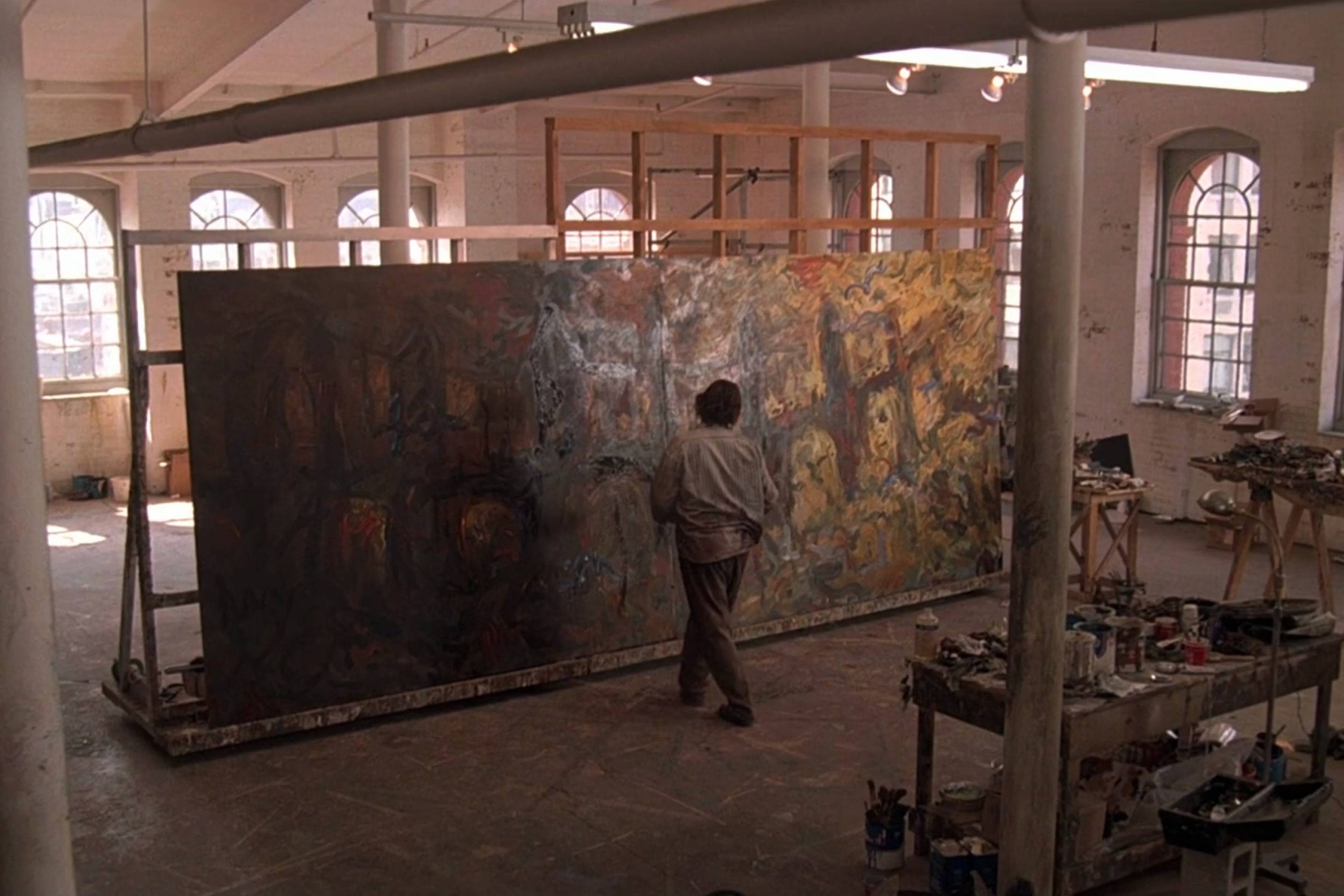 A screenshot of Nick Nolte facing a giant canvas in his loft in Martin Scorsese's segment of "New York Stories."