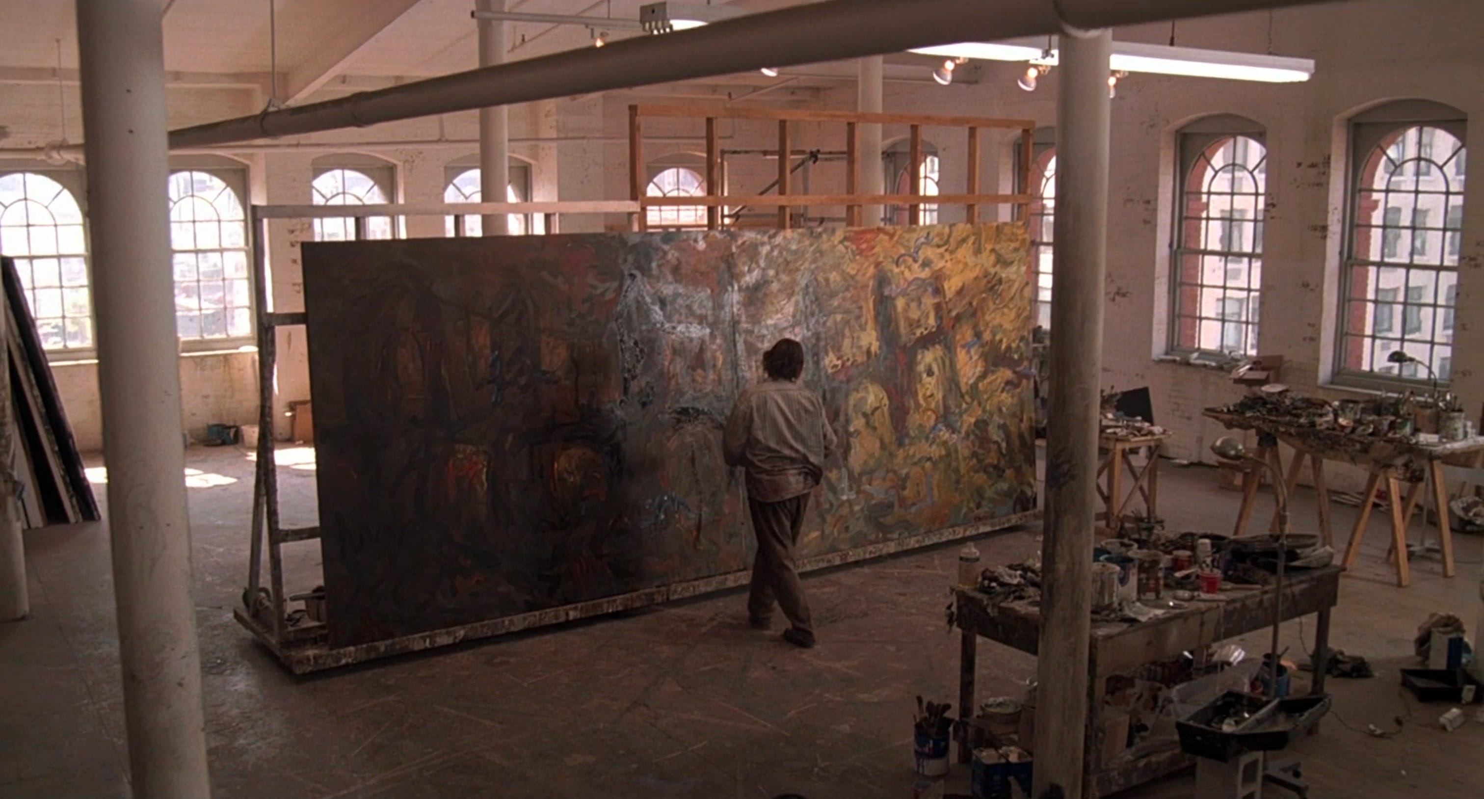 A screenshot of Nick Nolte facing a giant canvas in his loft in Martin Scorsese's segment of "New York Stories."