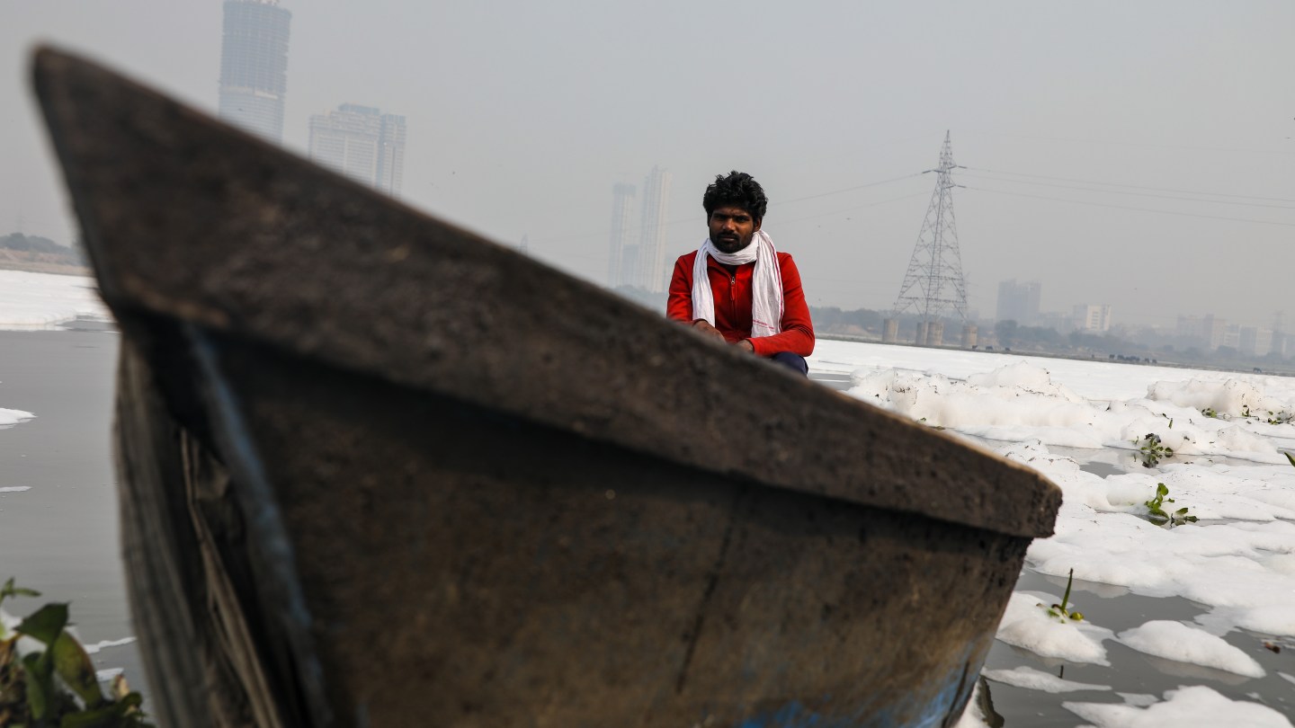 Afroz Alam sits in his boat.