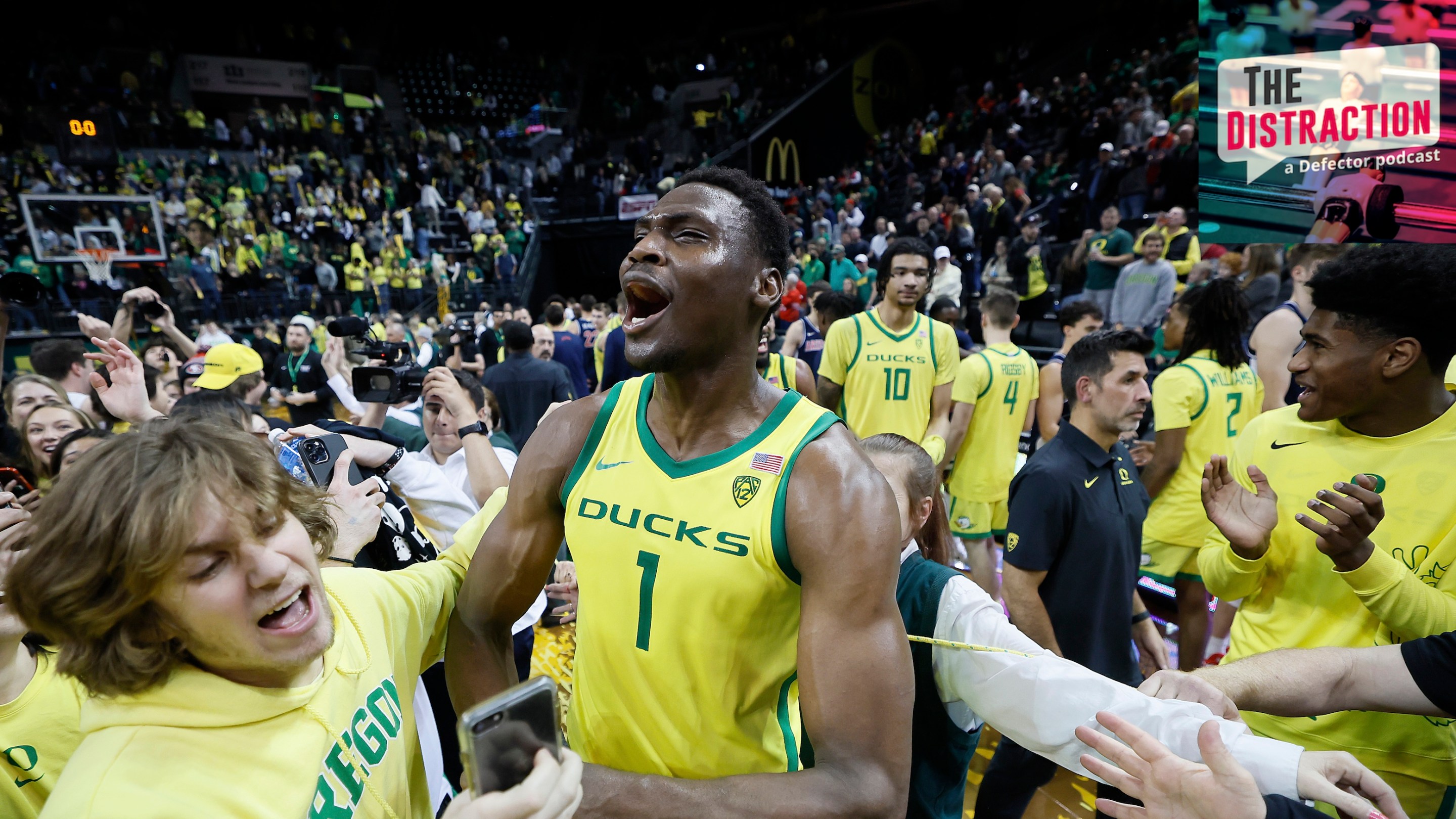 N'Faly Dante of the Oregon Ducks celebrates with fans after defeating the Arizona Wildcats at Matthew Knight Arena on January 14, 2023 in Eugene, Oregon.