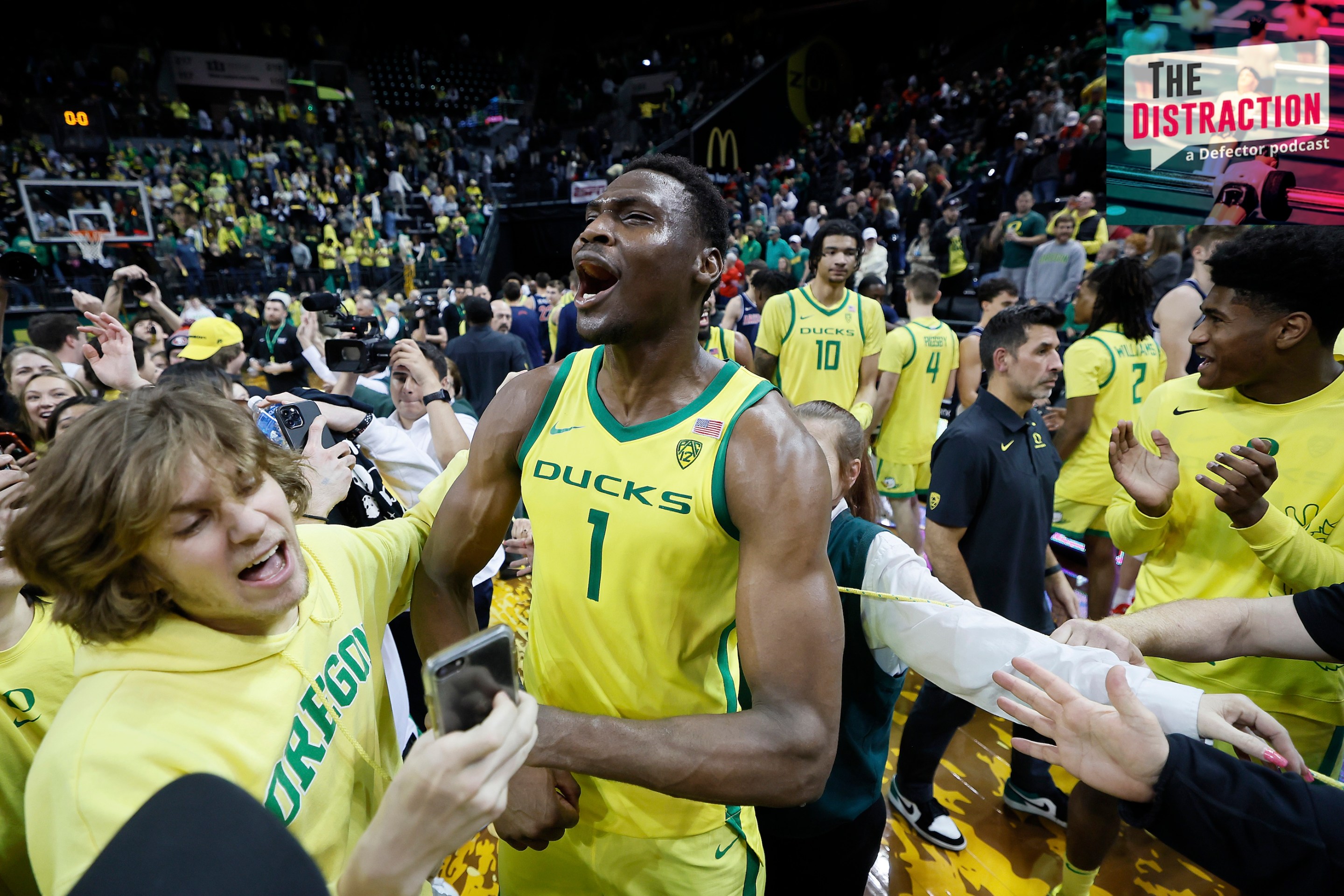 N'Faly Dante of the Oregon Ducks celebrates with fans after defeating the Arizona Wildcats at Matthew Knight Arena on January 14, 2023 in Eugene, Oregon.