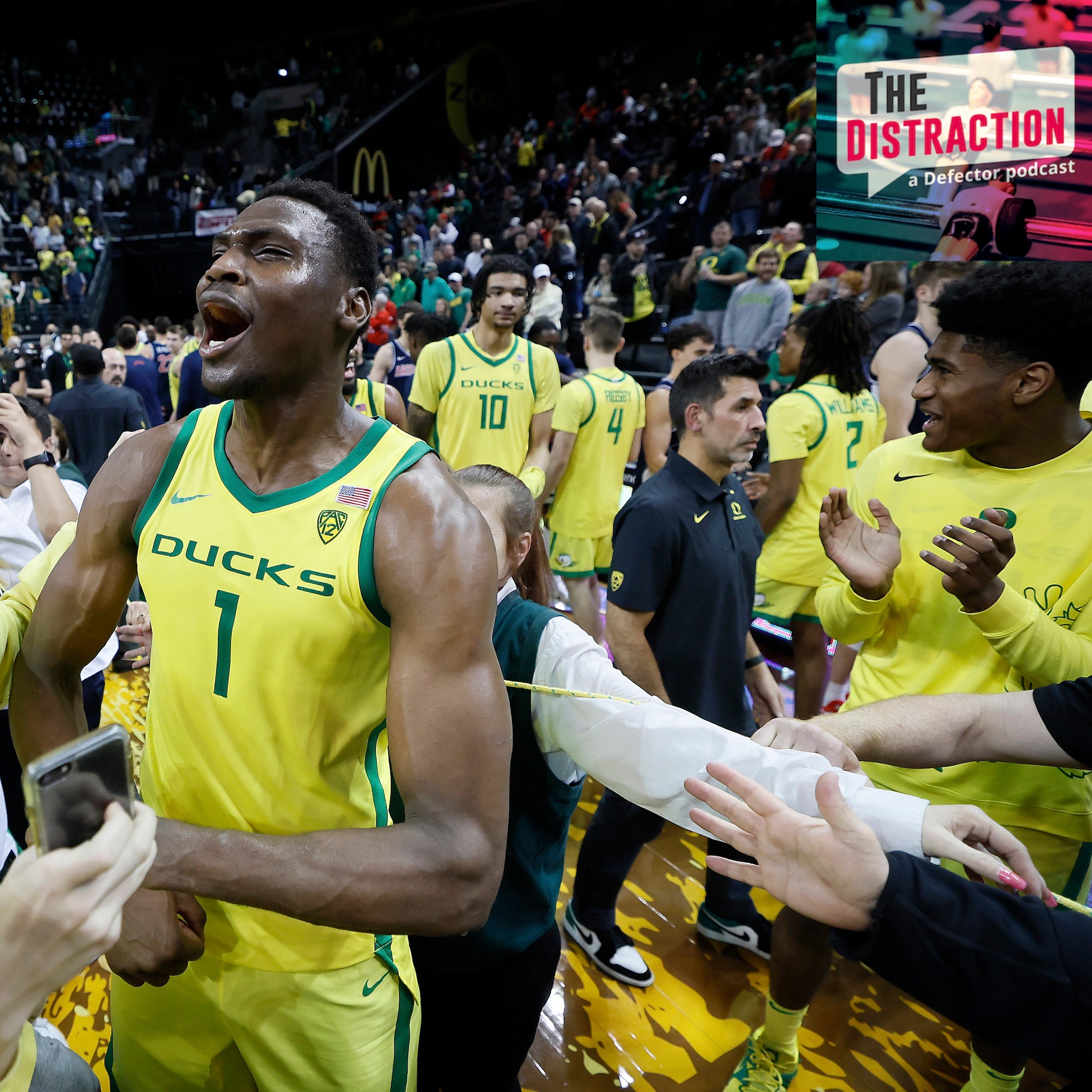 N'Faly Dante of the Oregon Ducks celebrates with fans after defeating the Arizona Wildcats at Matthew Knight Arena on January 14, 2023 in Eugene, Oregon.