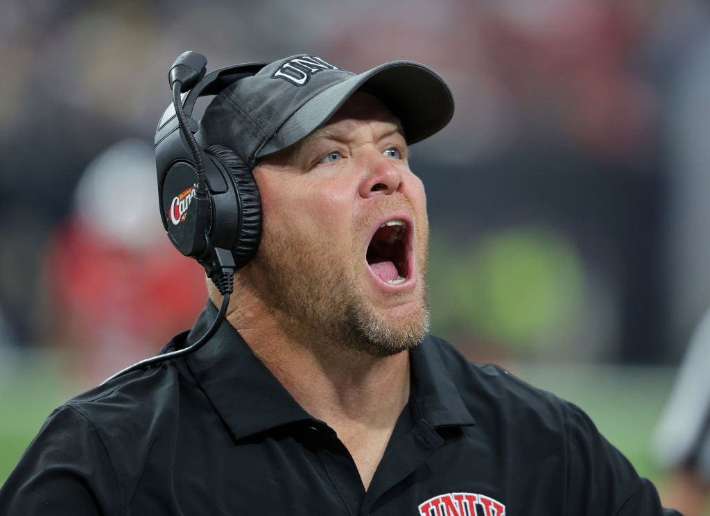 Head coach Barry Odom of the UNLV Rebels yells to fans in the second quarter of a game against the Vanderbilt Commodores at Allegiant Stadium on September 16, 2023 in Las Vegas, Nevada.