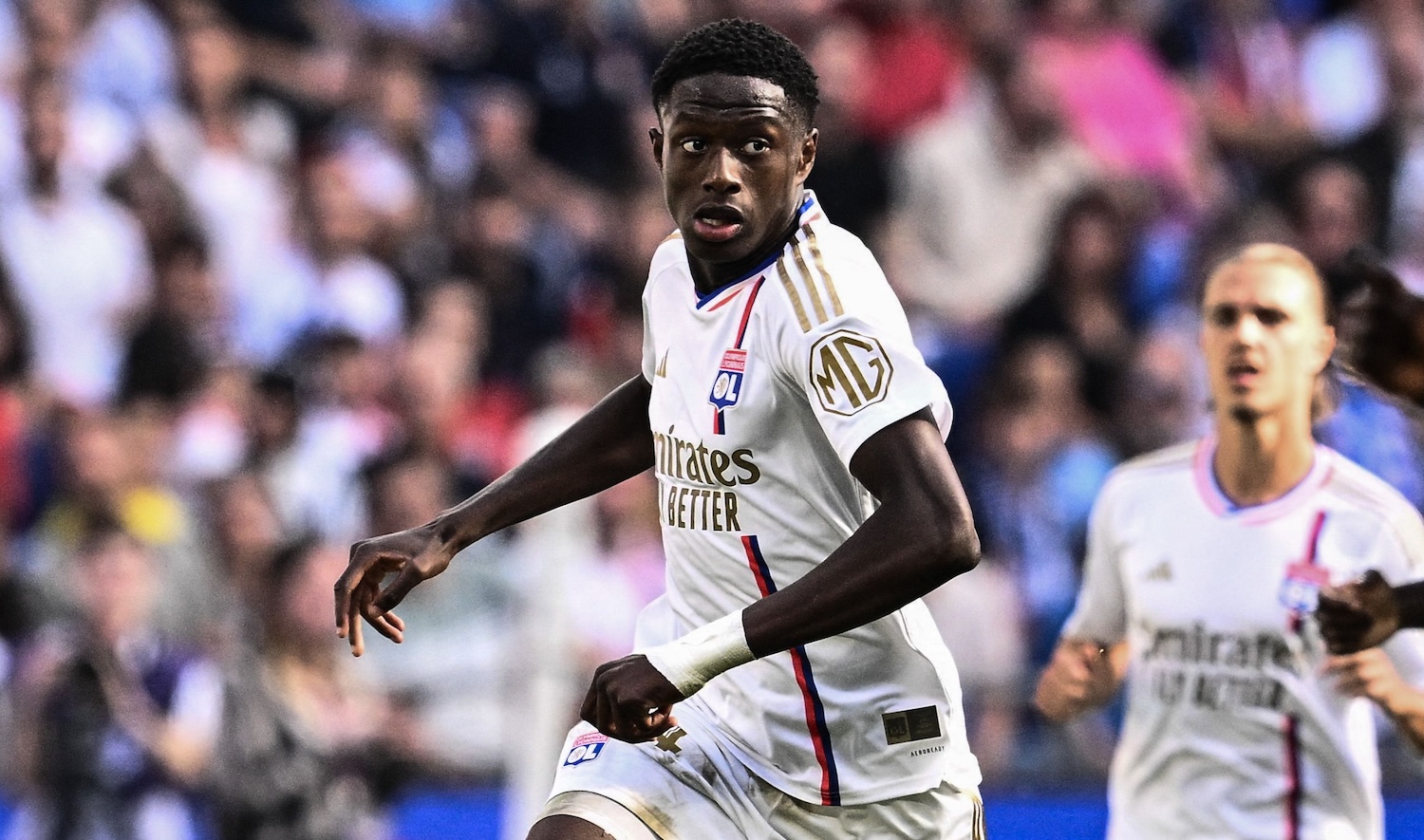 Lyon's French midfielder #34 Mahamadou Diawara (C) leads the ball during the French L1 football match between Olympique Lyonnais (OL) and FC Lorient (FCL) at The Groupama Stadium in Decines-Charpieu, central-eastern France on October 8, 2023. (Photo by JEFF PACHOUD / AFP) (Photo by JEFF PACHOUD/AFP via Getty Images)