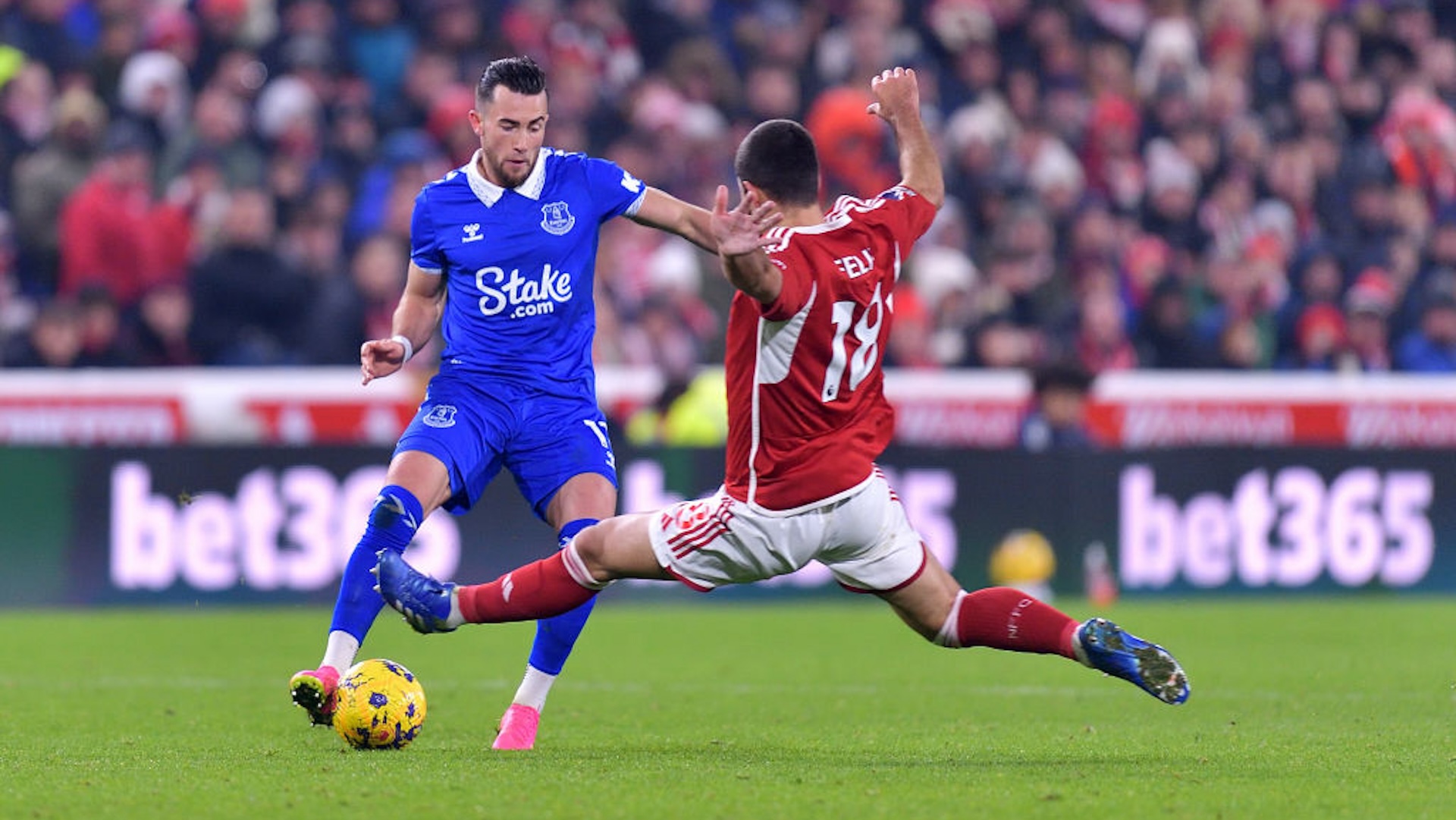 Jack Harrison (L) of Everton and Felipe challenge for the ball during the Premier League match between Nottingham Forest and Everton FC at City Ground on December 02, 2023 in Nottingham, England.