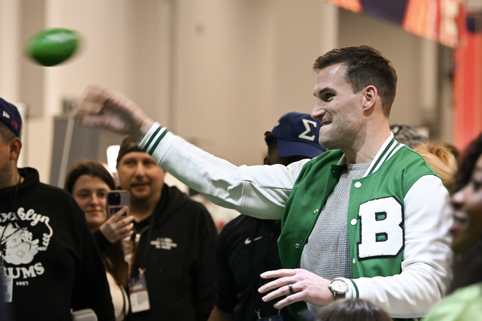 LAS VEGAS, NEVADA - FEBRUARY 09: Kirk Cousins throws a mini football at Radio Row at the Mandalay Bay Convention Center ahead of Super Bowl LVIII on February 09, 2024 in Las Vegas, Nevada. (Photo by Candice Ward/Getty Images)