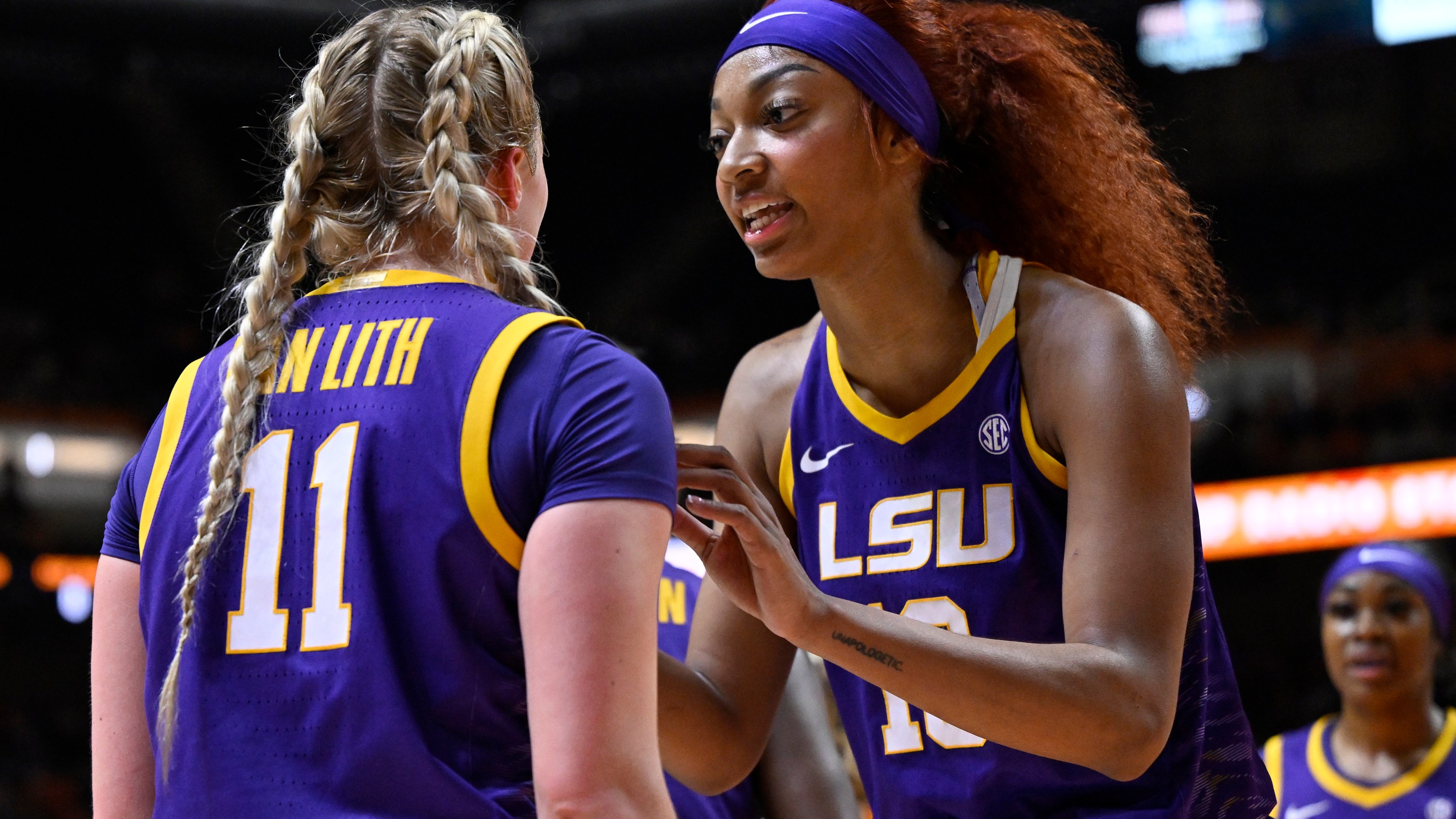 Hailey Van Lith #11 and Angel Reese #10 of the LSU Lady Tigers speak against the Tennessee Lady Vols in the second quarter at Thompson-Boling Arena on February 25, 2024 in Knoxville, Tennessee.