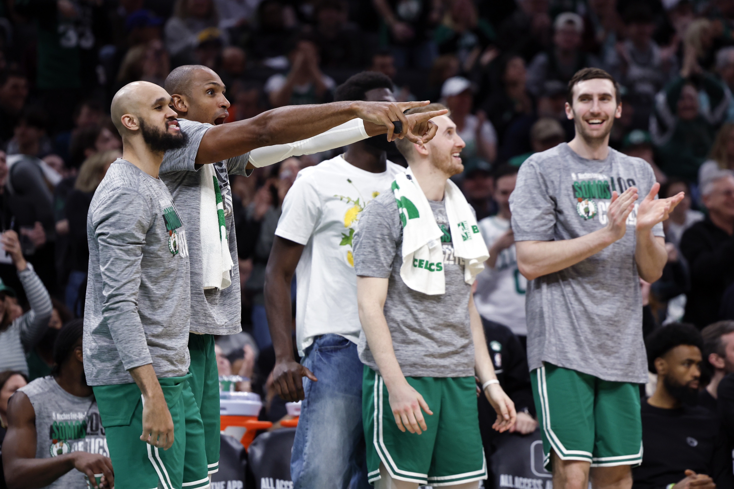 Boston Celtics center Al Horford (second from left) and the bench react to a slam dunk by Boston Celtics guard Svi Mykhailiuk (not pictured) in the fourth quarter. The Celtics beat the Golden State Warriors, 140-88.
