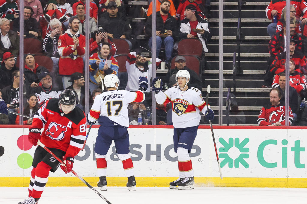 Florida Panthers center Eetu Luostarinen (27) celebrates with Florida Panthers center Evan Rodrigues (17) after scoring a goal