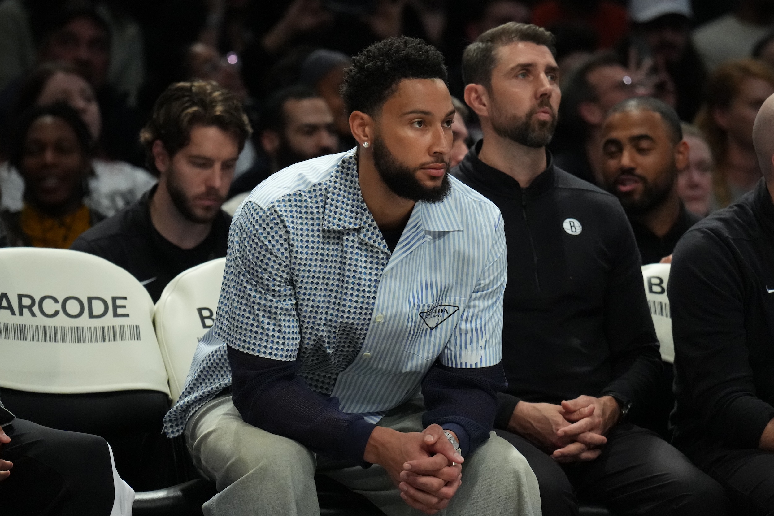 Ben Simmons sits on the bench.