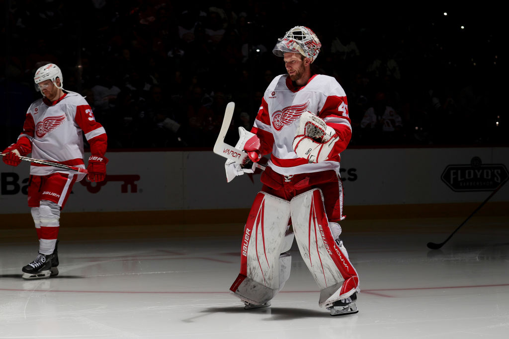 J.T. Compher #37 and goaltenderJames Reimer #47 of the Detroit Red Wings take to the ice