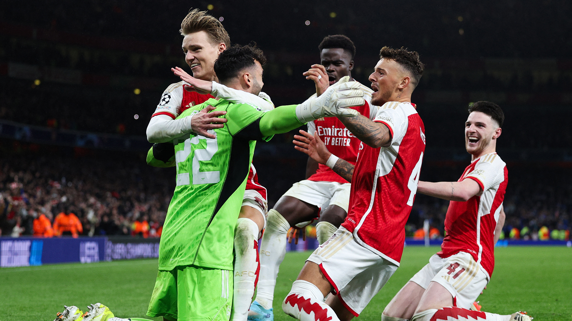 Arsenal's Spanish goalkeeper #22 David Raya, Arsenal's Norwegian midfielder #08 Martin Odegaard, Arsenal's English midfielder #07 Bukayo Saka, Arsenal's English defender #04 Ben White and Arsenal's English midfielder #41 Declan Rice celebrate after winning the penalty shoot-out session the UEFA Champions League last 16 second leg football match between Arsenal and Porto FC at the Arsenal Stadium in north London, on March 12, 2024