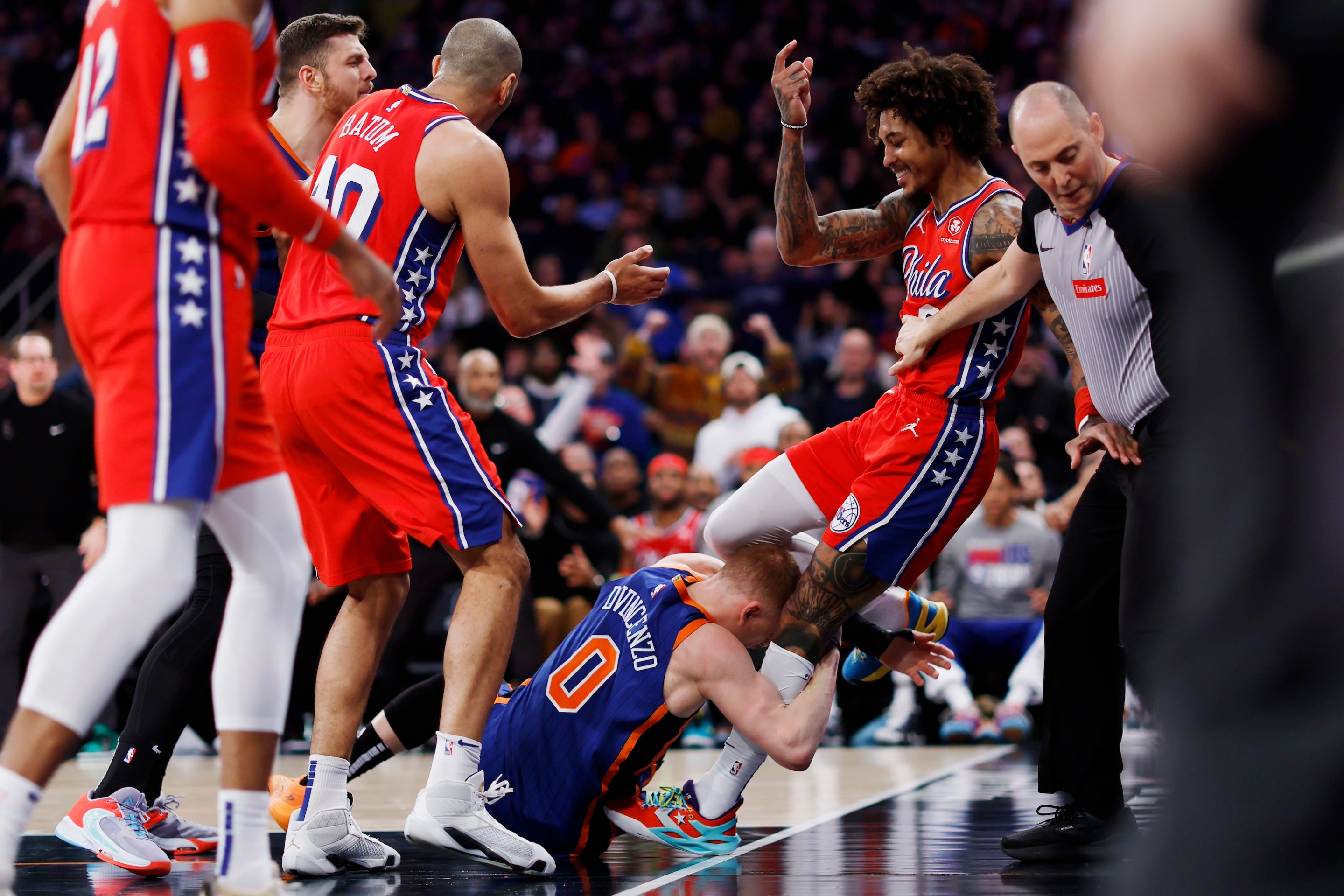 NEW YORK, NEW YORK - MARCH 10: Donte DiVincenzo #0 of the New York Knicks grabs Kelly Oubre Jr. #9 of the Philadelphia 76ers starting an altercation during the second half at Madison Square Garden on March 10, 2024 in New York City. The 76ers won 79-73. NOTE TO USER: User expressly acknowledges and agrees that, by downloading and or using this photograph, User is consenting to the terms and conditions of the Getty Images License Agreement. (Photo by Sarah Stier/Getty Images)