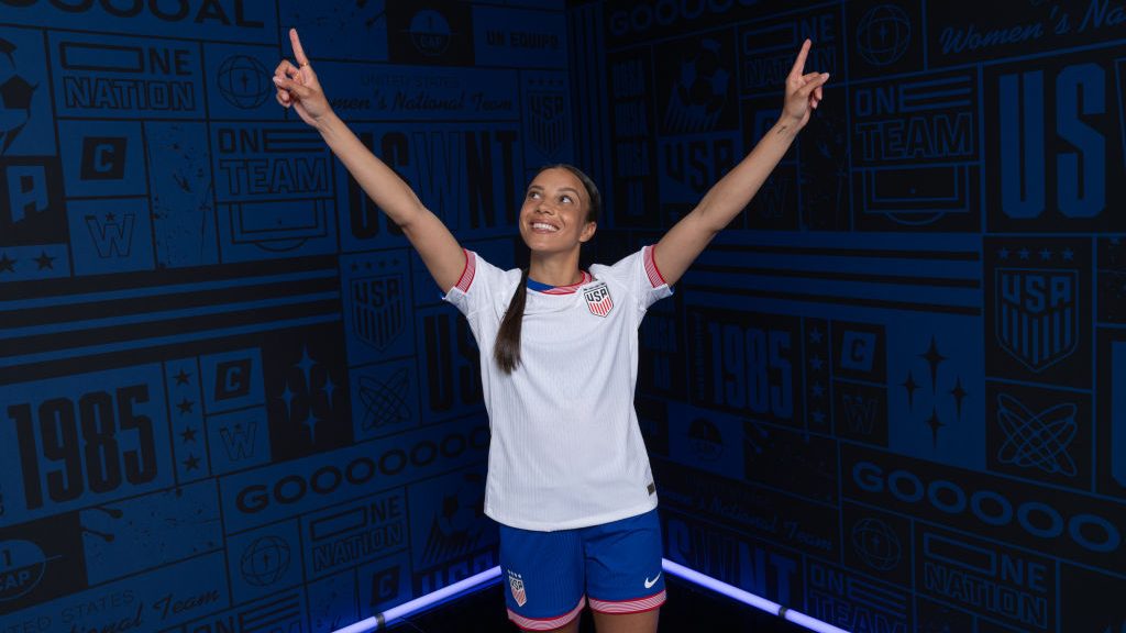 Mallory Swanson poses with her arms in the air during a USWNT portrait studio session on February 13, 2024 in Los Angeles, California.