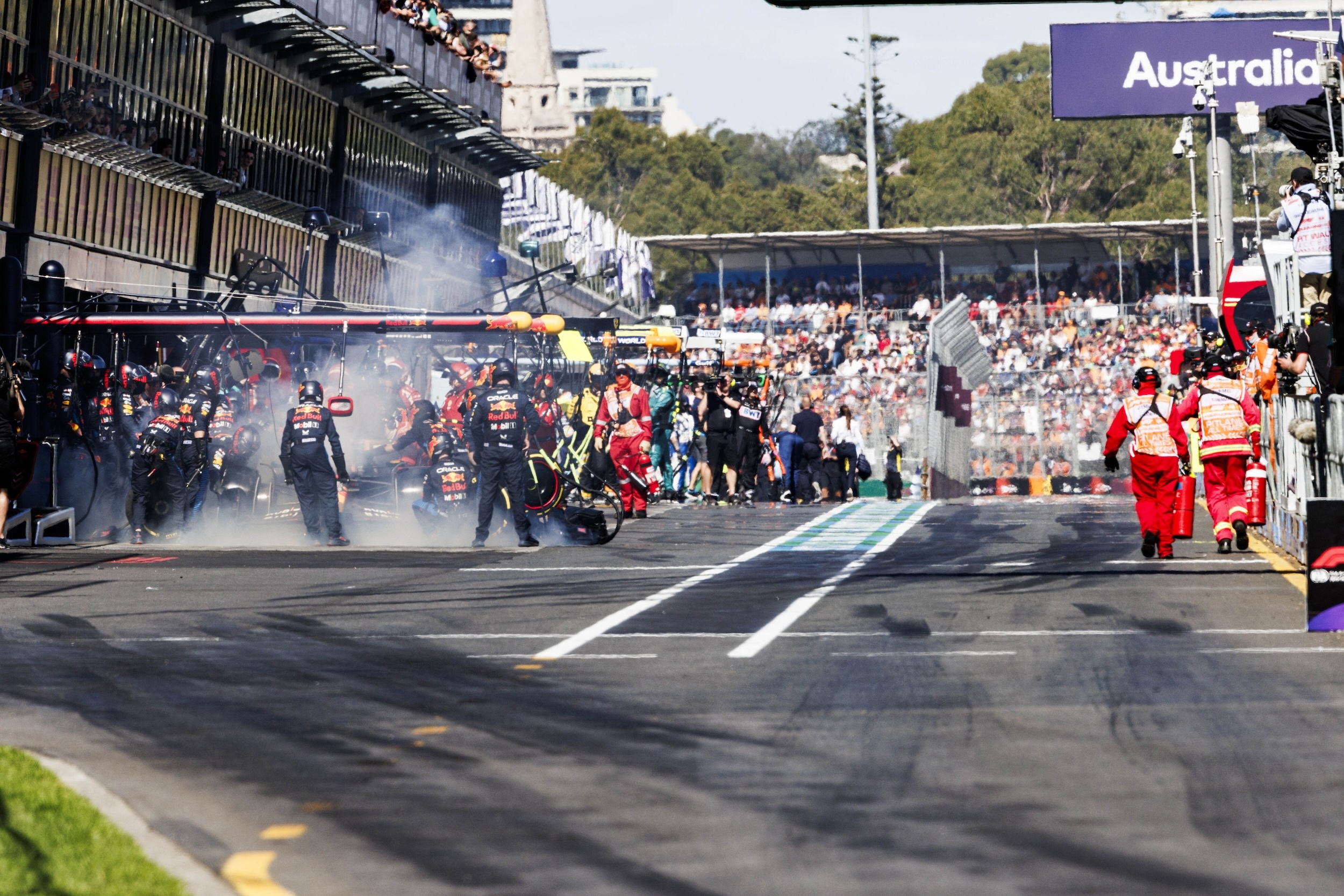 Max Verstappen's Red Bull car sends off a lot of smoke.