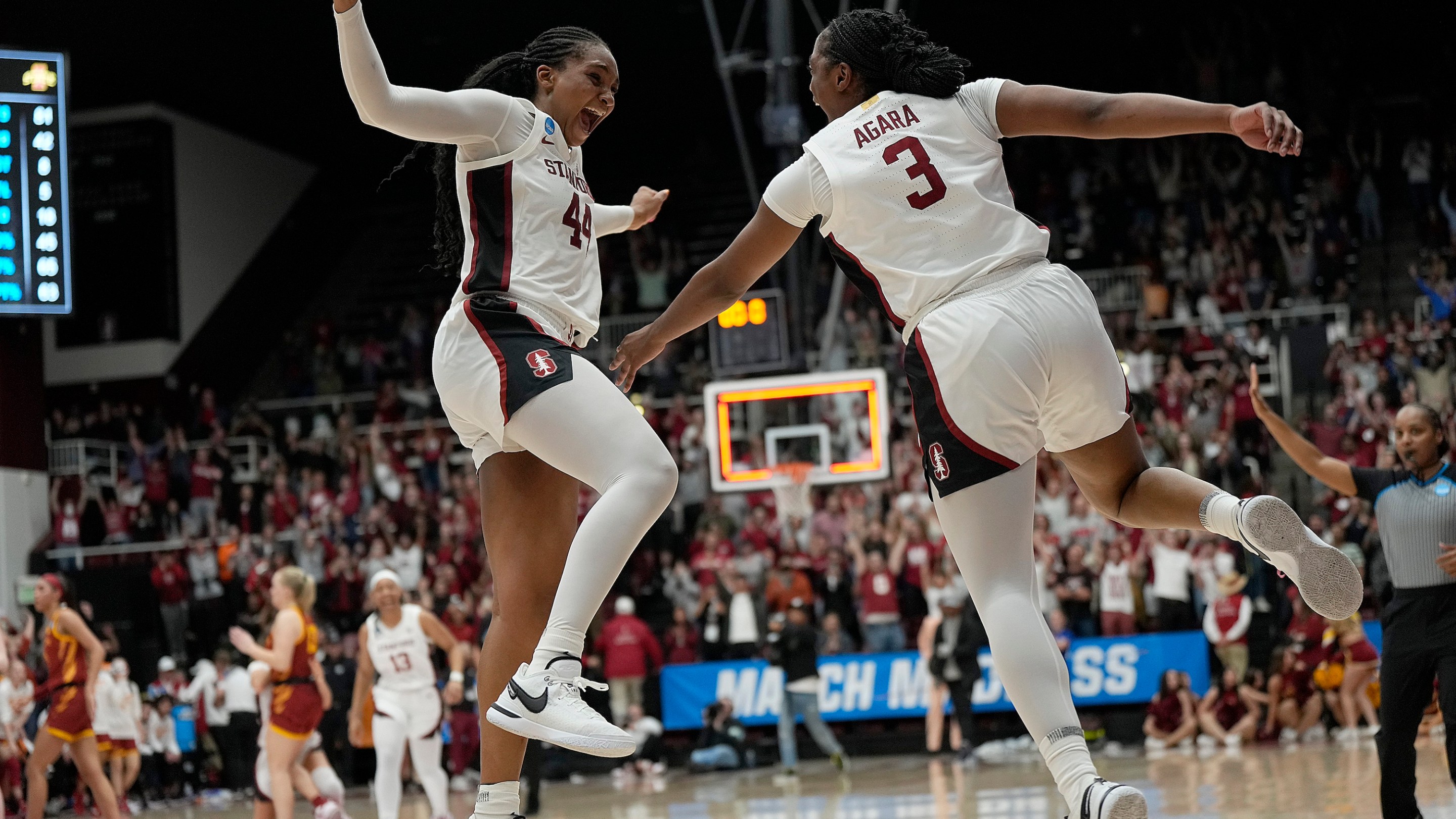 PALO ALTO, CALIFORNIA - MARCH 24: Kiki Iriafen #44 and Nunu Agara #3 of the Stanford Cardinal celebrates after they defeated the Iowa State Cyclones 87-81 in overtime in the second round of the NCAA Women's Basketball Tournament at Stanford Maples Pavilion on March 24, 2024 in Palo Alto, California. (Photo by Thearon W. Henderson/Getty Images)