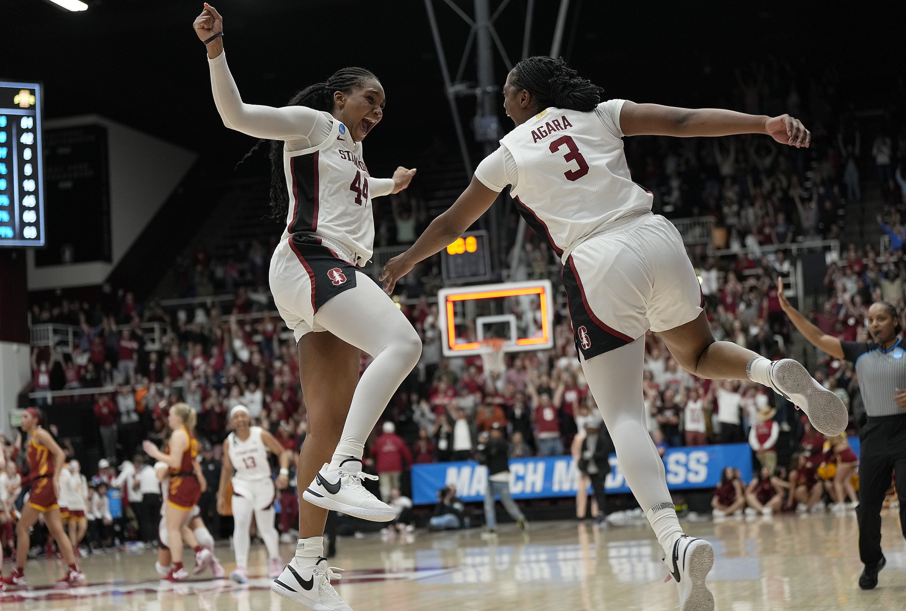 PALO ALTO, CALIFORNIA - MARCH 24: Kiki Iriafen #44 and Nunu Agara #3 of the Stanford Cardinal celebrates after they defeated the Iowa State Cyclones 87-81 in overtime in the second round of the NCAA Women's Basketball Tournament at Stanford Maples Pavilion on March 24, 2024 in Palo Alto, California. (Photo by Thearon W. Henderson/Getty Images)