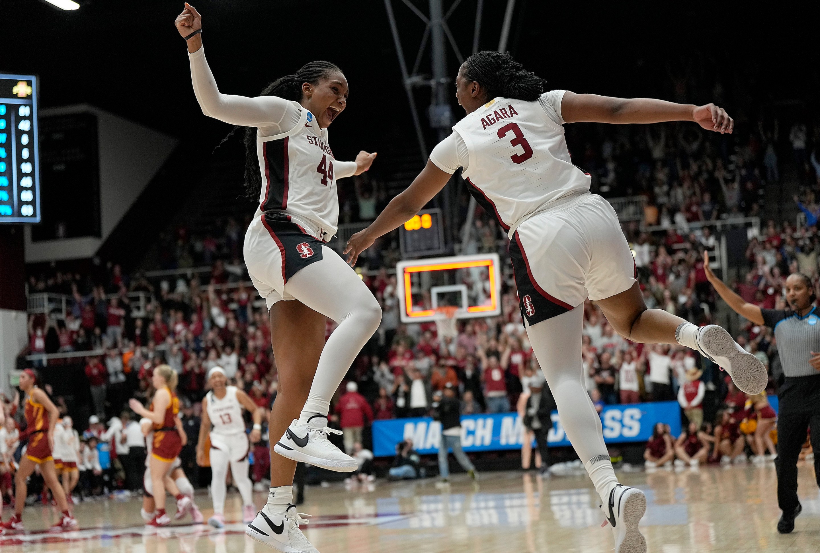 PALO ALTO, CALIFORNIA - MARCH 24: Kiki Iriafen #44 and Nunu Agara #3 of the Stanford Cardinal celebrates after they defeated the Iowa State Cyclones 87-81 in overtime in the second round of the NCAA Women's Basketball Tournament at Stanford Maples Pavilion on March 24, 2024 in Palo Alto, California. (Photo by Thearon W. Henderson/Getty Images)