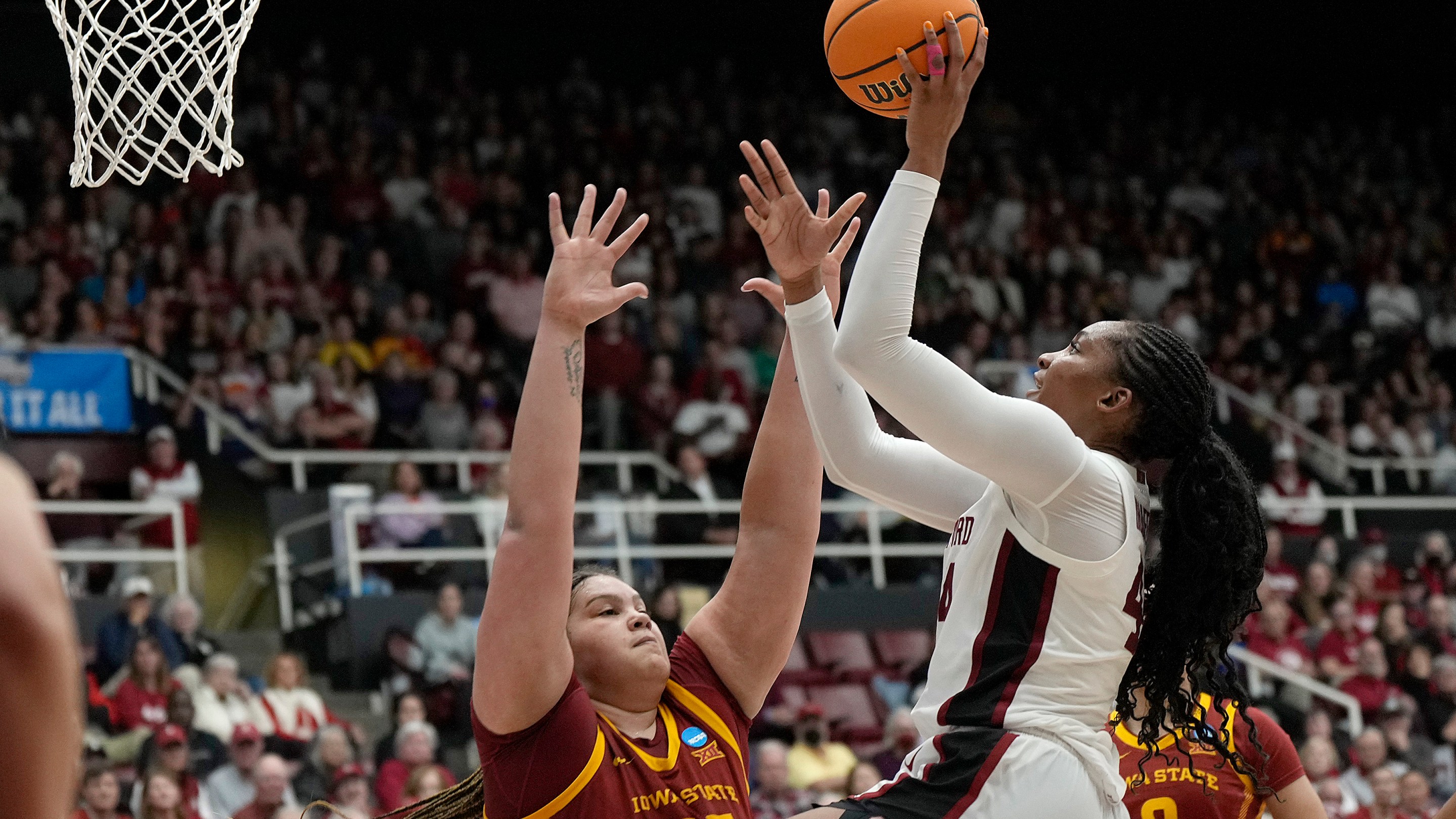Kiki Iriafen #44 of the Stanford Cardinal drives to the basket on Audi Crooks #55 of the Iowa State Cyclones during the second half in the second round of the NCAA Women's Basketball Tournament at Stanford Maples Pavilion on March 24, 2024 in Palo Alto, California.