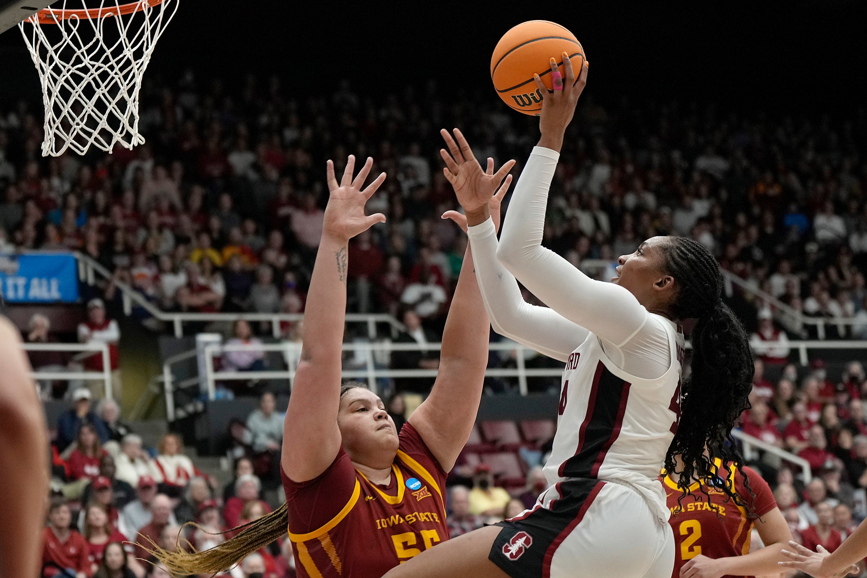 Kiki Iriafen #44 of the Stanford Cardinal drives to the basket on Audi Crooks #55 of the Iowa State Cyclones during the second half in the second round of the NCAA Women's Basketball Tournament at Stanford Maples Pavilion on March 24, 2024 in Palo Alto, California.