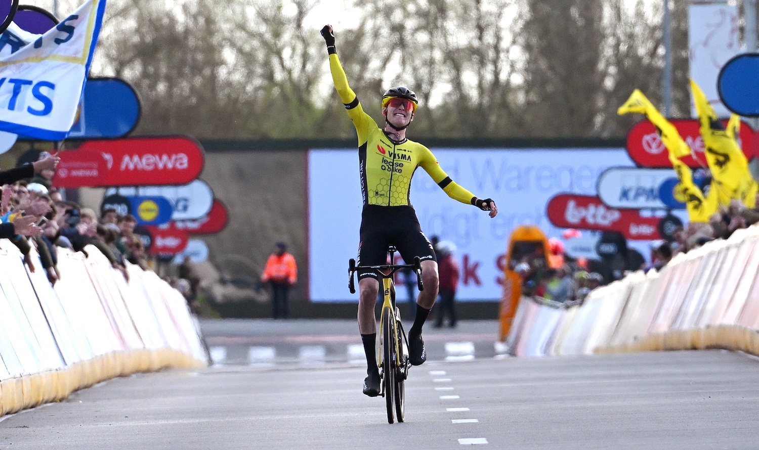 WAREGEM, BELGIUM - MARCH 27: Matteo Jorgenson of The United States and Team Visma | Lease a Bike celebrates at finish line as race winner during the 78th Dwars Door Vlaanderen 2024 - Men's Elite a 188.6km one day race from Roeselare to Waregem / #UCIWT / on March 27, 2024 in Waregem, Belgium. (Photo by Tim de Waele/Getty Images)
