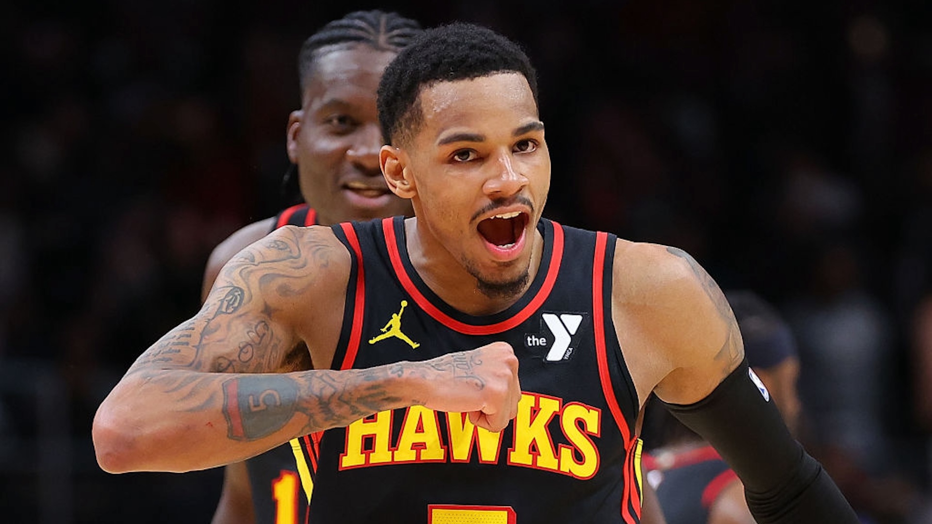 Dejounte Murray #5 of the Atlanta Hawks reacts after hitting the game-winning basket during overtime against the Boston Celtics at State Farm Arena on March 28, 2024 in Atlanta,