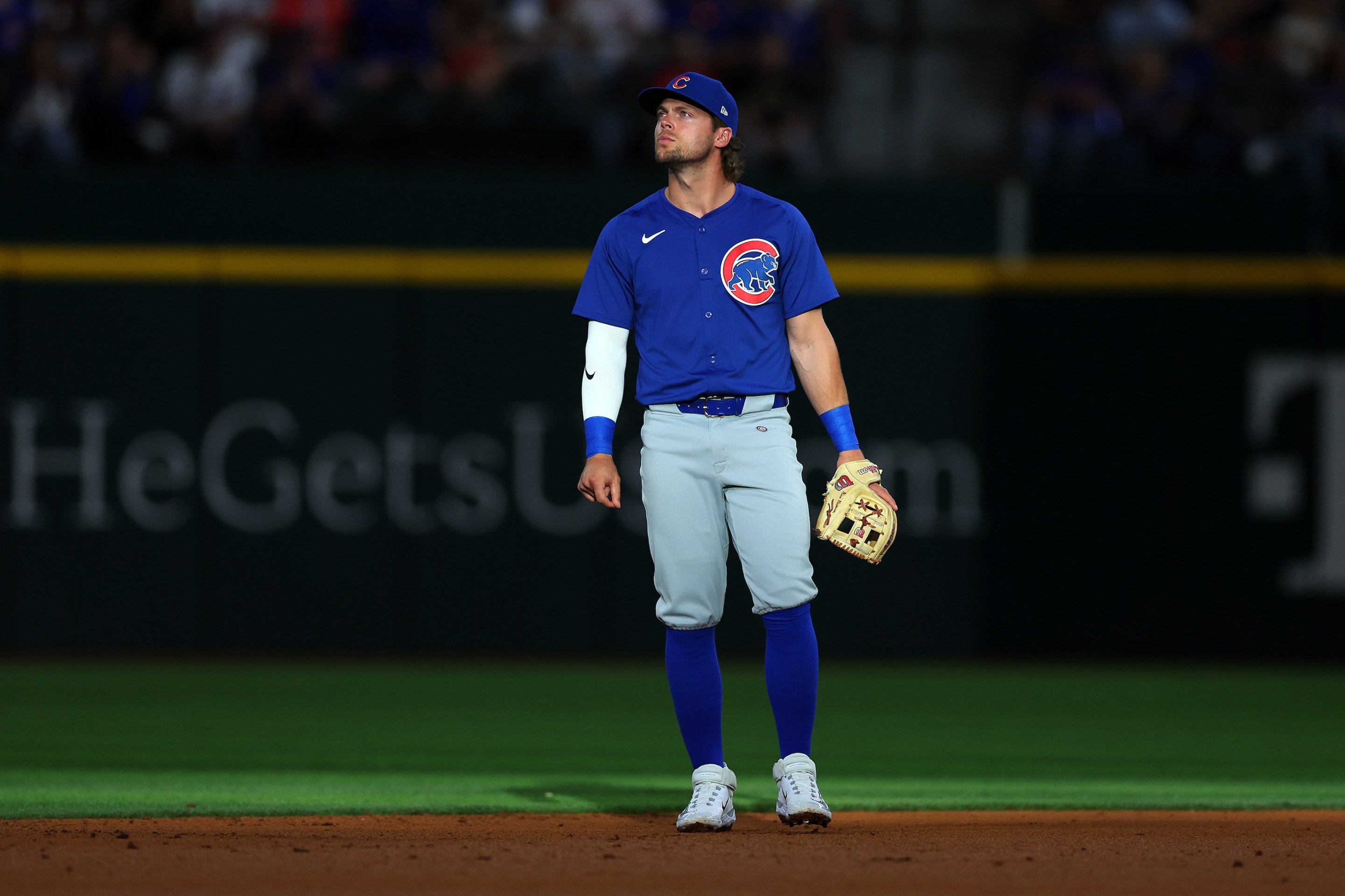 Nico Hoerner of the Chicago Cubs looks kind of wistful during the Opening Day game against the Texas Rangers at Globe Life Field on March 28, 2024 in Arlington, Texas.