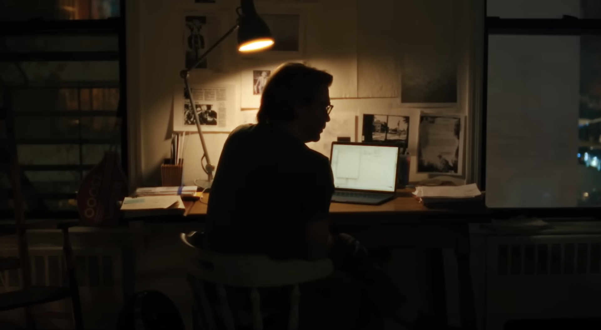 Christian Hansen sitting at his desk in The Octopus Murders