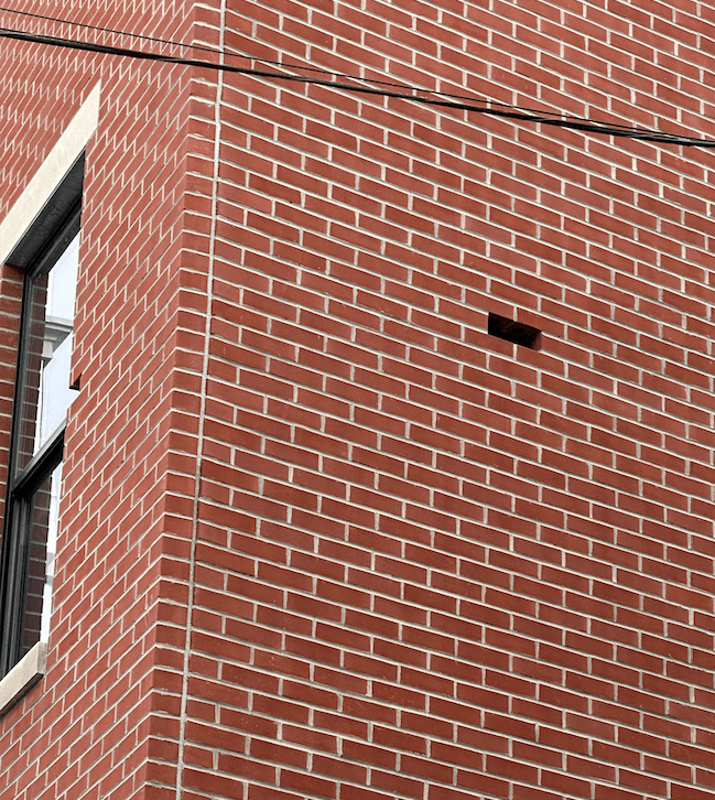 close up of missing brick in building