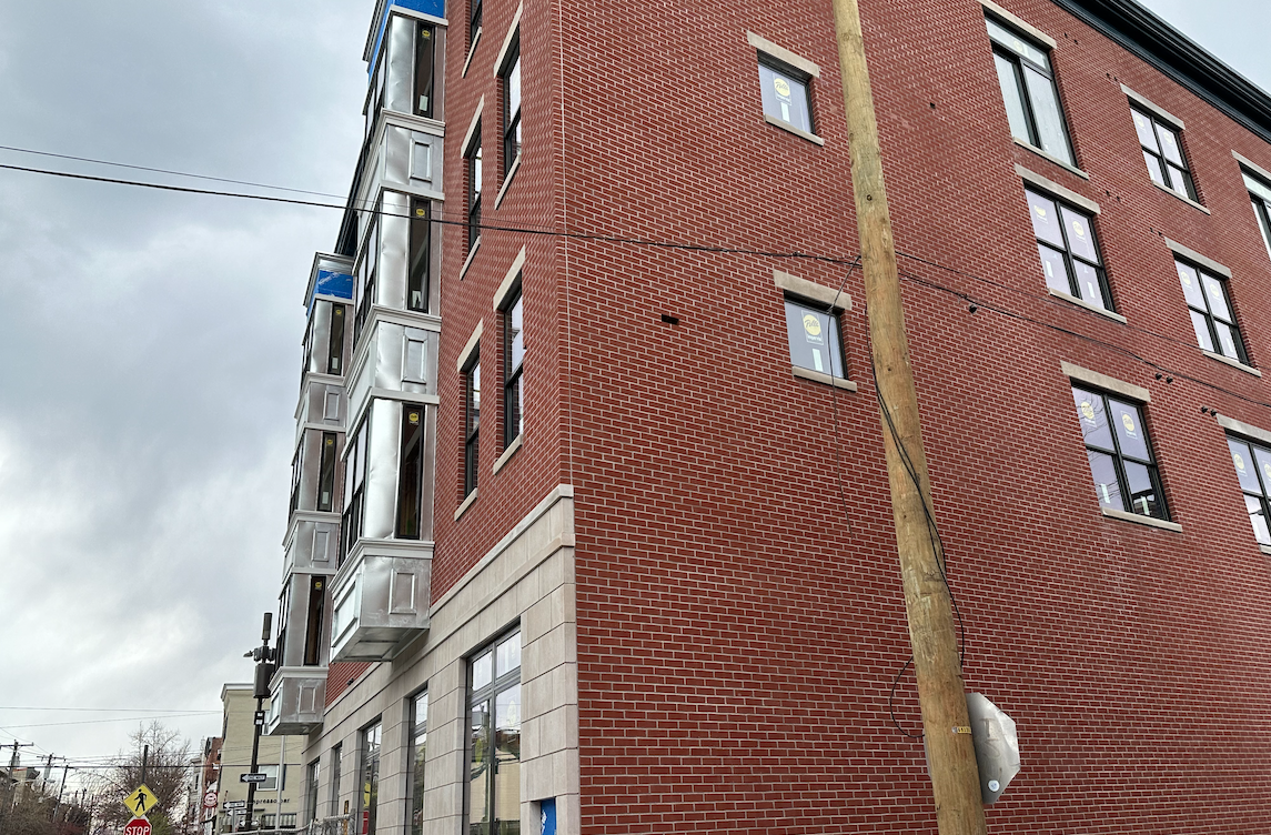 photo of brick building with missing brick