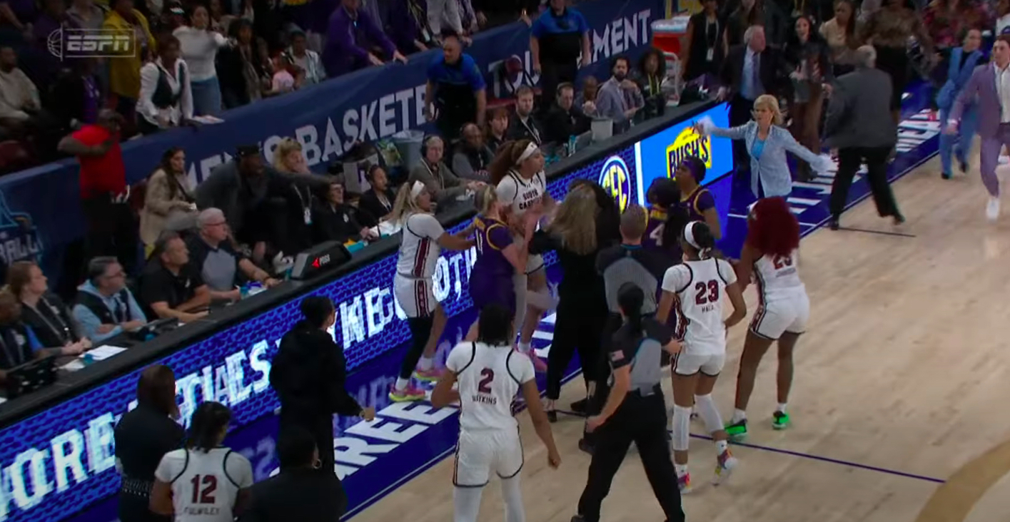 South Carolina and LSU players fight at the end of the SEC Tournament championship game.