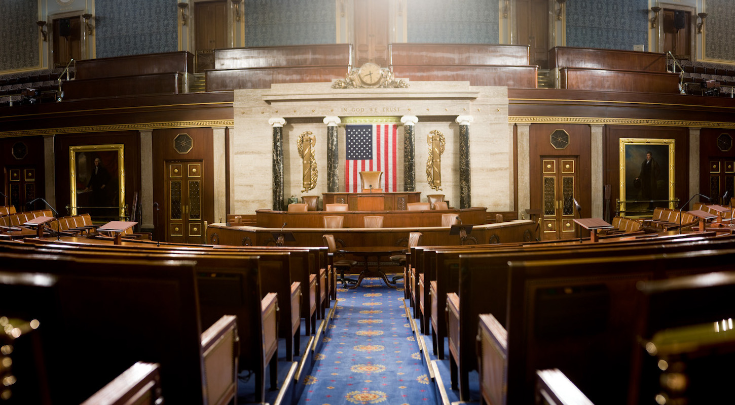 The rostrum of the U.S. House of Representatives, with the entire chamber empty.