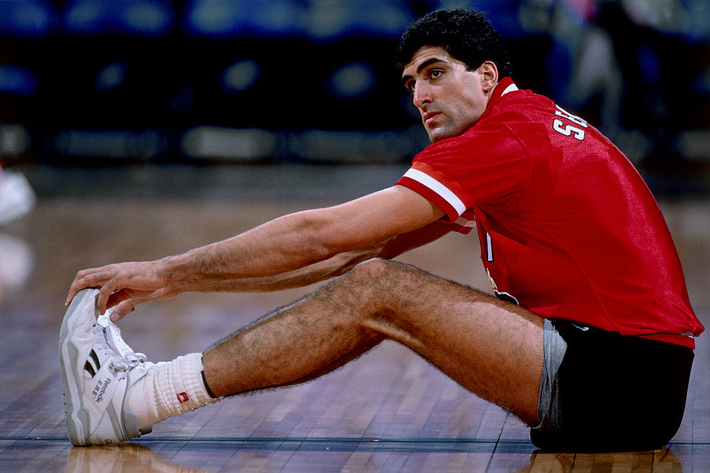 Rony Seikaly stretches prior to a game