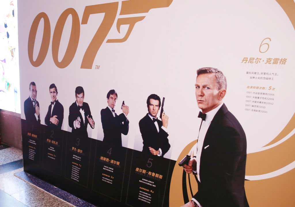 A promotional poster for the James Bond film "No Time To Die" starring Daniel Craig at a cineplex in Shanghai showing all six actors who have played the character James Bond.