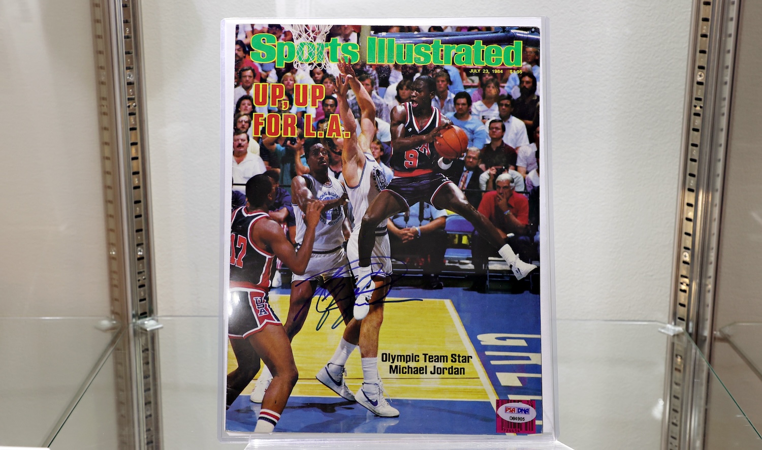 NEW YORK, NEW YORK - JULY 21: Michael Jordan signed Sports Illustrated cover is on display during a press preview of The Olympic Collection at Sotheby's on July 21, 2021 in New York City. (Photo by Cindy Ord/Getty Images)