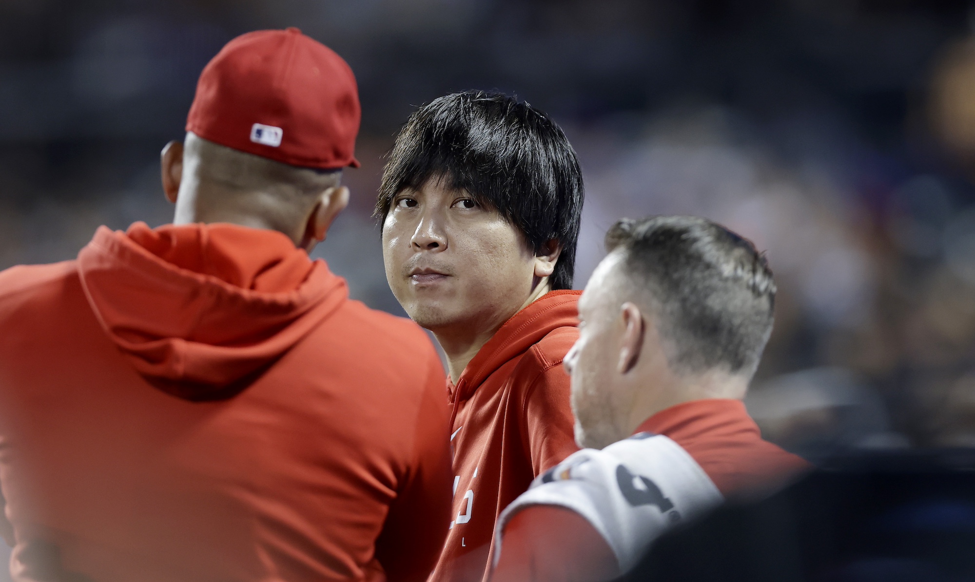 NEW YORK, NEW YORK - AUGUST 25: Interpreter Ippei Mizuhara of the Los Angeles Angels looks on against the New York Mets at Citi Field on August 25, 2023 in New York City. The Angels defeated the Mets 3-1. (Photo by Jim McIsaac/Getty Images)