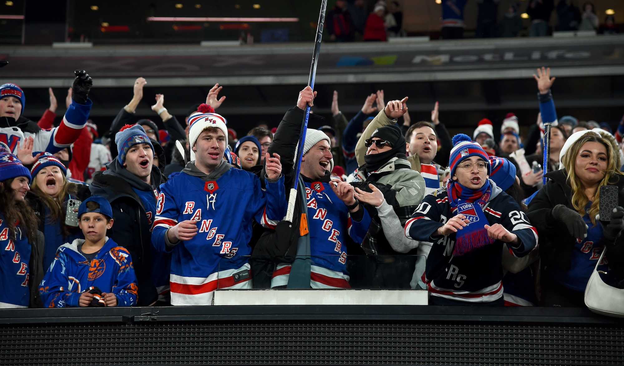 EAST RUTHERFORD, NEW JERSEY - FEBRUARY 18: New York Rangers fans cheer on after the 2024 Navy Federal Credit Union Stadium Series game between the New York Rangers and the New York Islanders at MetLife Stadium on February 18, 2024 in East Rutherford, New Jersey. The Rangers defeated the Islanders 6-5 in overtime. (Photo by Brian Babineau/NHLI via Getty Images)