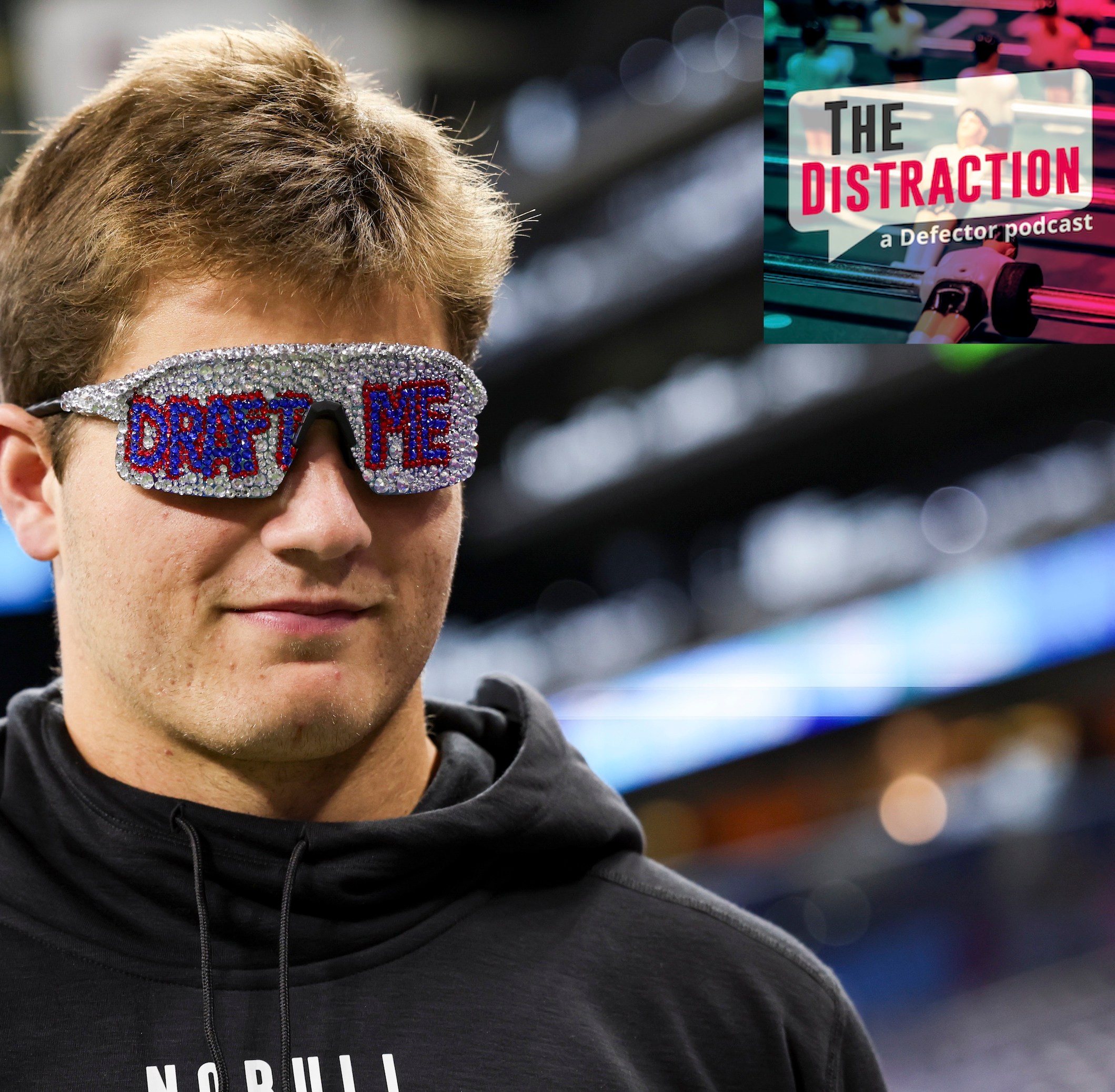 Drake Maye wears "Draft Me" sunglasses during the NFL Scouting Combine at Lucas Oil Stadium on March 2, 2024 in Indianapolis, Indiana.