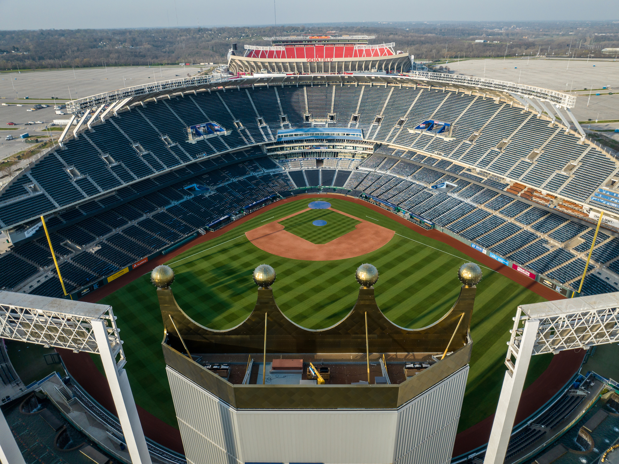 Kauffman Stadium is the home of the Kansas City Royals and beyond it is GEHA Field at Arrowhead Stadium which is the home of the Kansas City Chiefs.