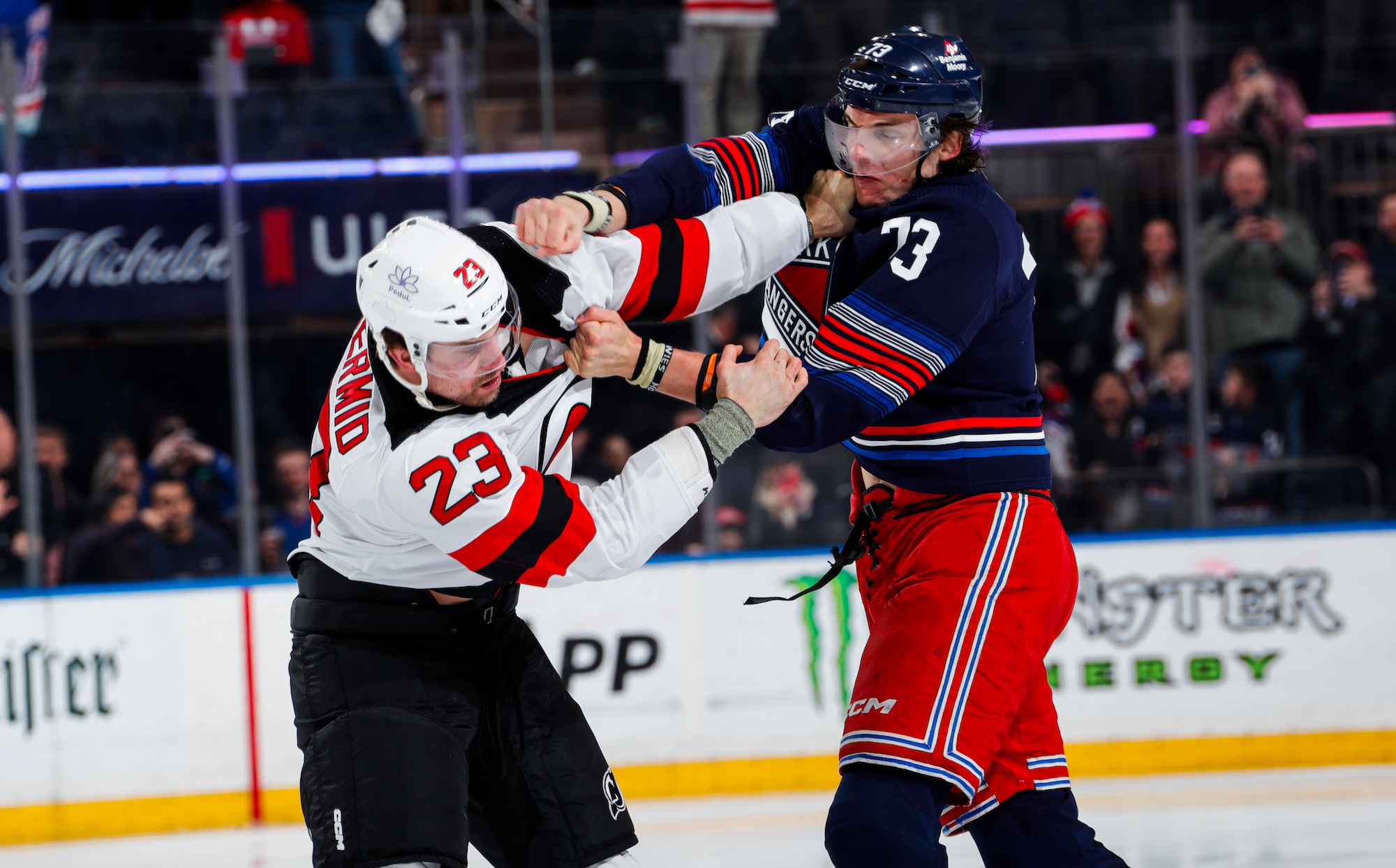 NEW YORK, NEW YORK - APRIL 03: Matt Rempe #73 of the New York Rangers fights Kurtis MacDermid #23 of the New Jersey Devils at Madison Square Garden on April 3, 2024 in New York City. (Photo by Jared Silber/NHLI via Getty Images)