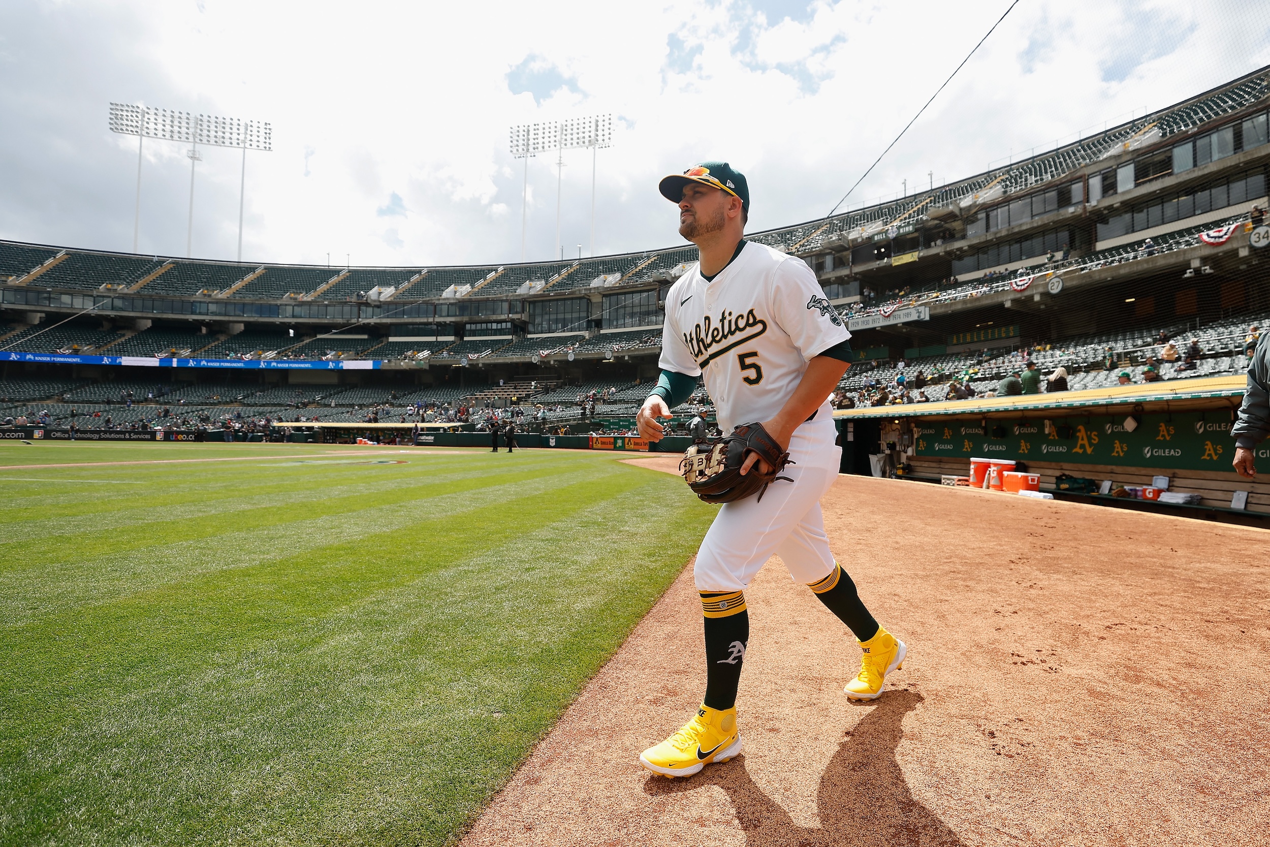 J.D. Davis takes the field at a nearly empty Oakland Coliseum.
