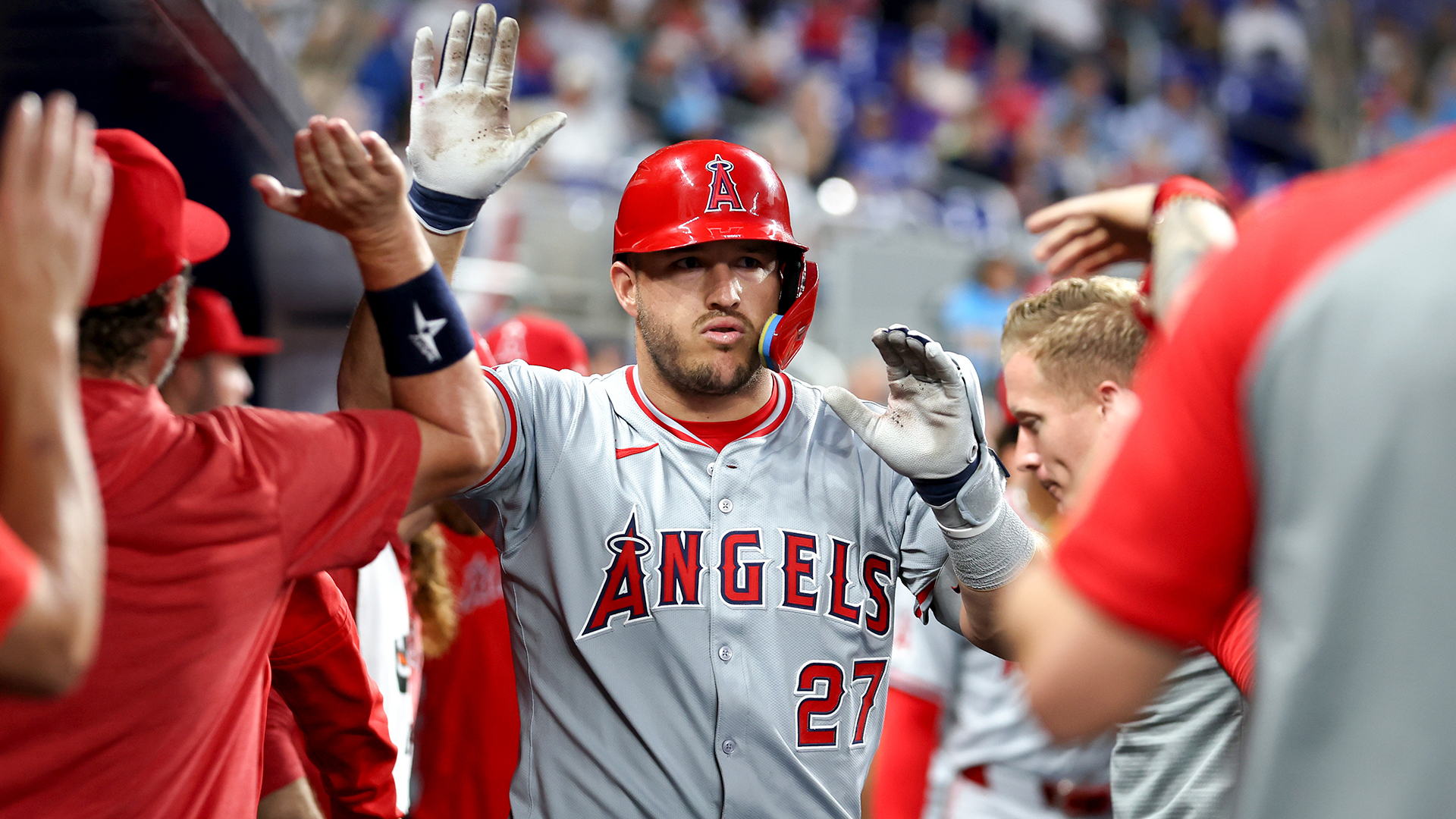 Mike Trout #27 of the Los Angeles Angels celebrates with teammates after hitting a home run against the Miami Marlins during the fourth inning of the game at loanDepot park on April 01, 2024 in Miami, Florida.