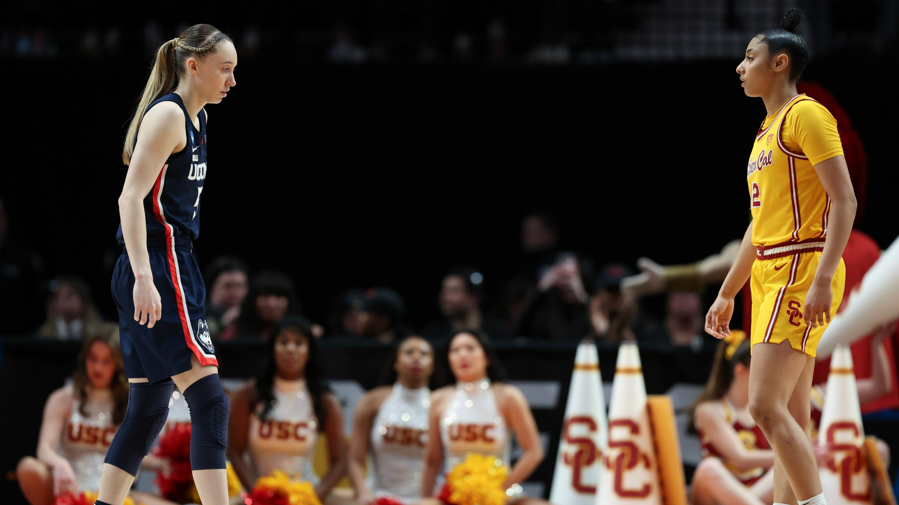 Paige Bueckers #5 of the Connecticut Huskies and JuJu Watkins #12 of the USC Trojans looks on during the second half in the Elite 8 round of the NCAA Women's Basketball Tournament at Moda Center on April 01, 2024 in Portland, Oregon.