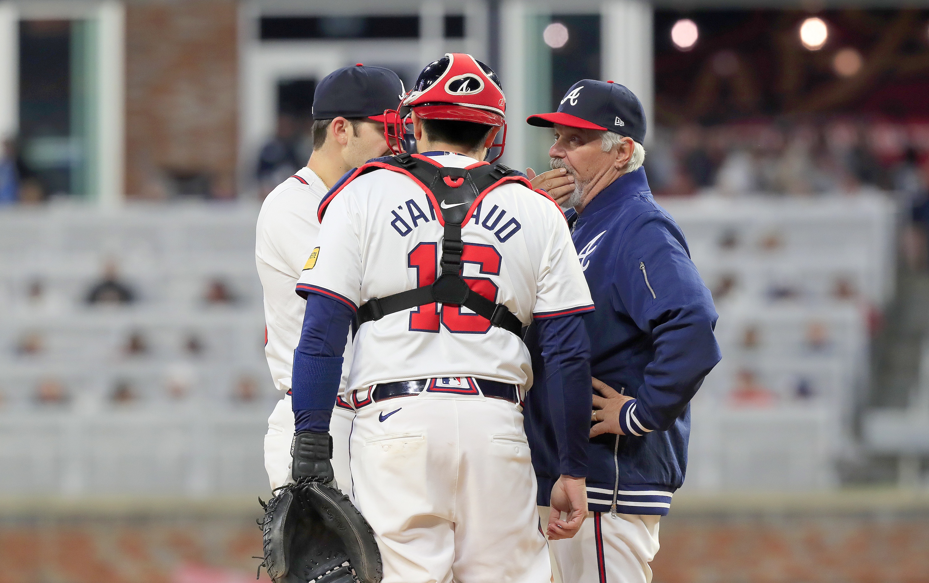 ATLANTA, GA - APRIL 05: Atlanta Braves pitching coach Rick Kranitz (r) talks to Atlanta Braves starting pitcher Spencer Strider (99) and Atlanta Braves catcher Travis d'Arnaud (16) at the pitching mound during the Atlanta Braves 2024 season Home Opener against the Arizona Diamondbacks on April 5, 2024 at Truist Park in Atlanta, Georgia. (Photo by David J. Griffin/Icon Sportswire via Getty Images)