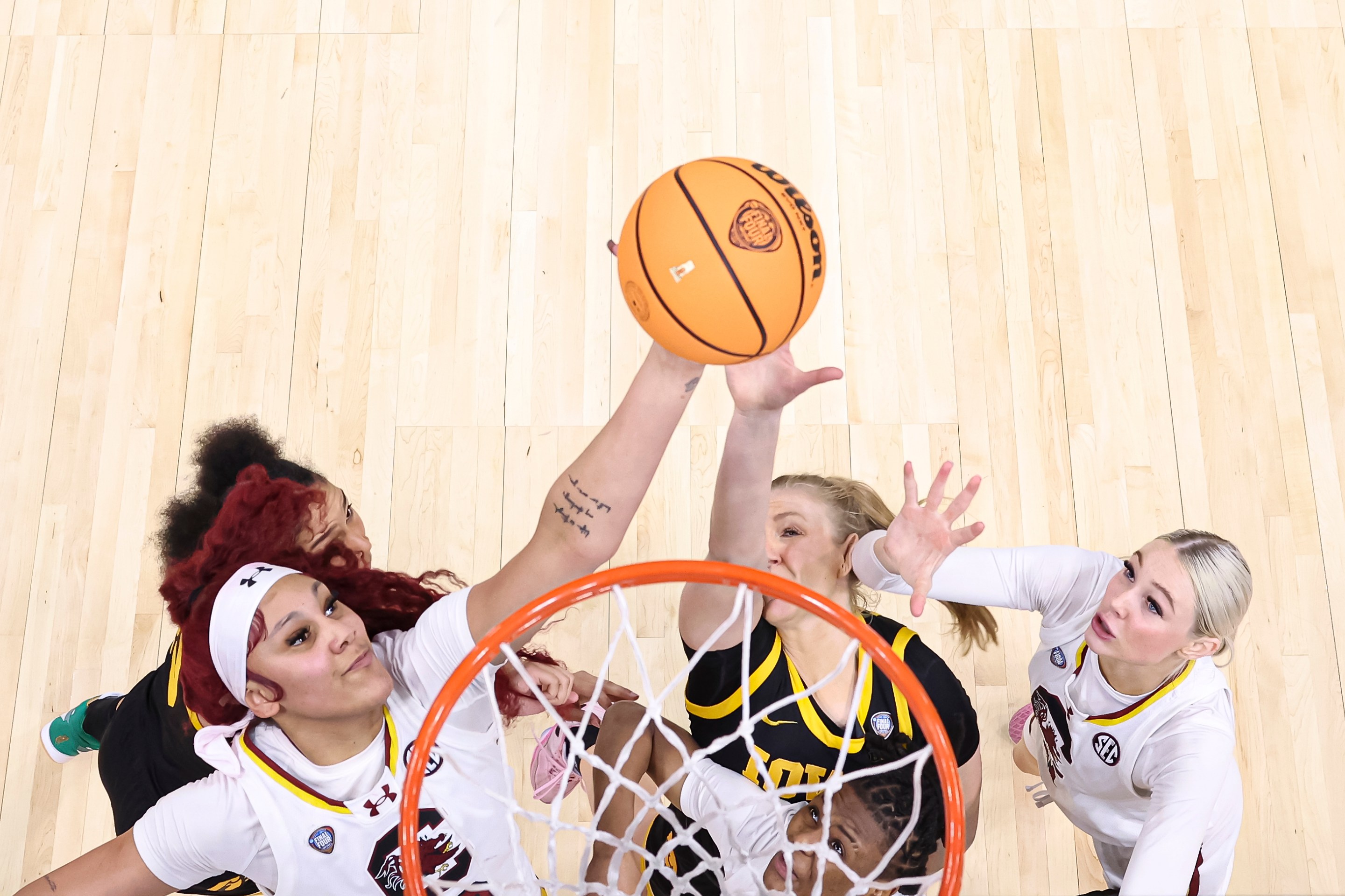 Kamilla Cardoso #10 of the South Carolina Gamecocks and Sydney Affolter #3 of the Iowa Hawkeyes jump for a rebound during the NCAA Women's Basketball Tournament Final Four National Championship game at Rocket Mortgage Fieldhouse on April 7, 2024 in Cleveland, Ohio.