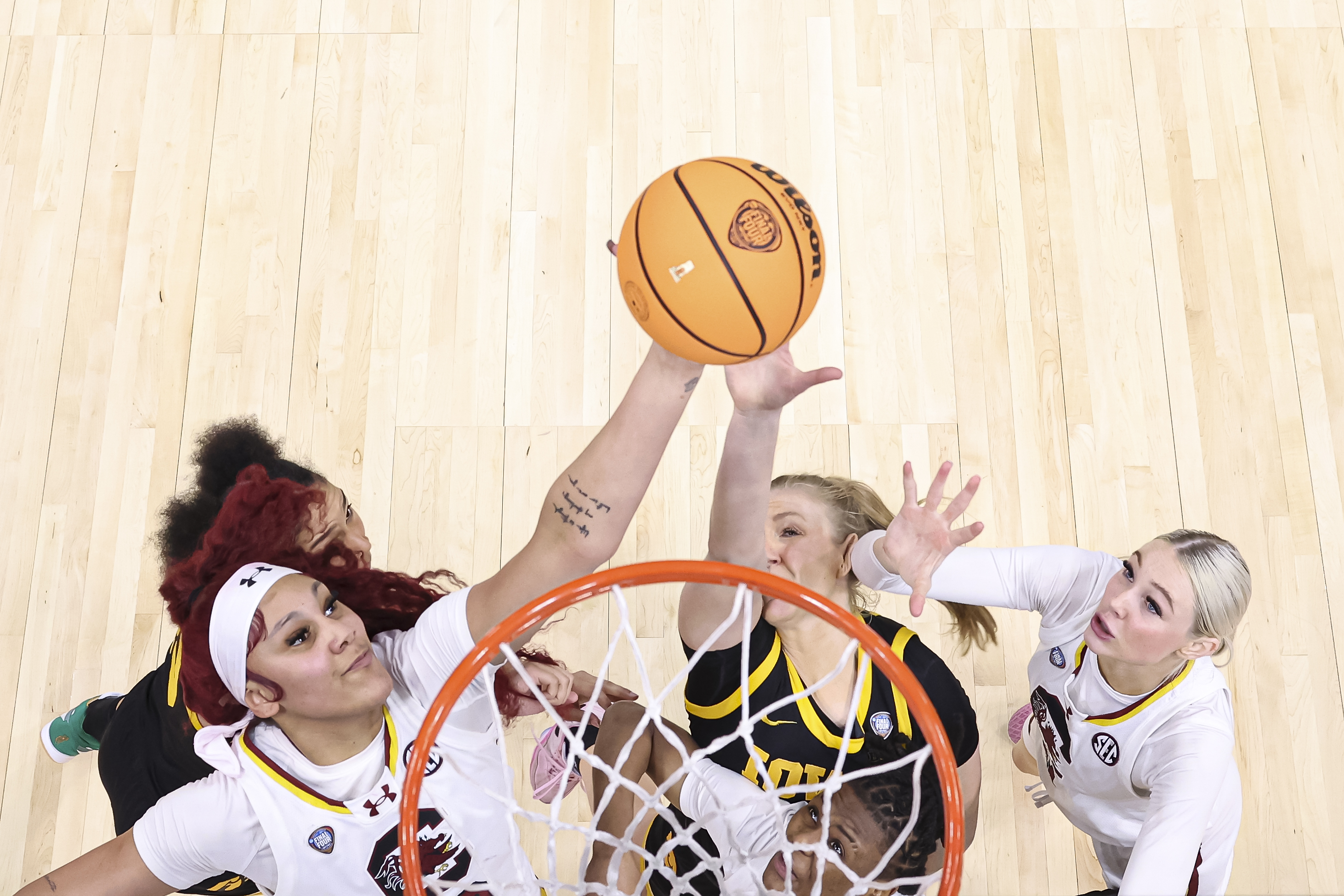 Kamilla Cardoso #10 of the South Carolina Gamecocks and Sydney Affolter #3 of the Iowa Hawkeyes jump for a rebound during the NCAA Women's Basketball Tournament Final Four National Championship game at Rocket Mortgage Fieldhouse on April 7, 2024 in Cleveland, Ohio.
