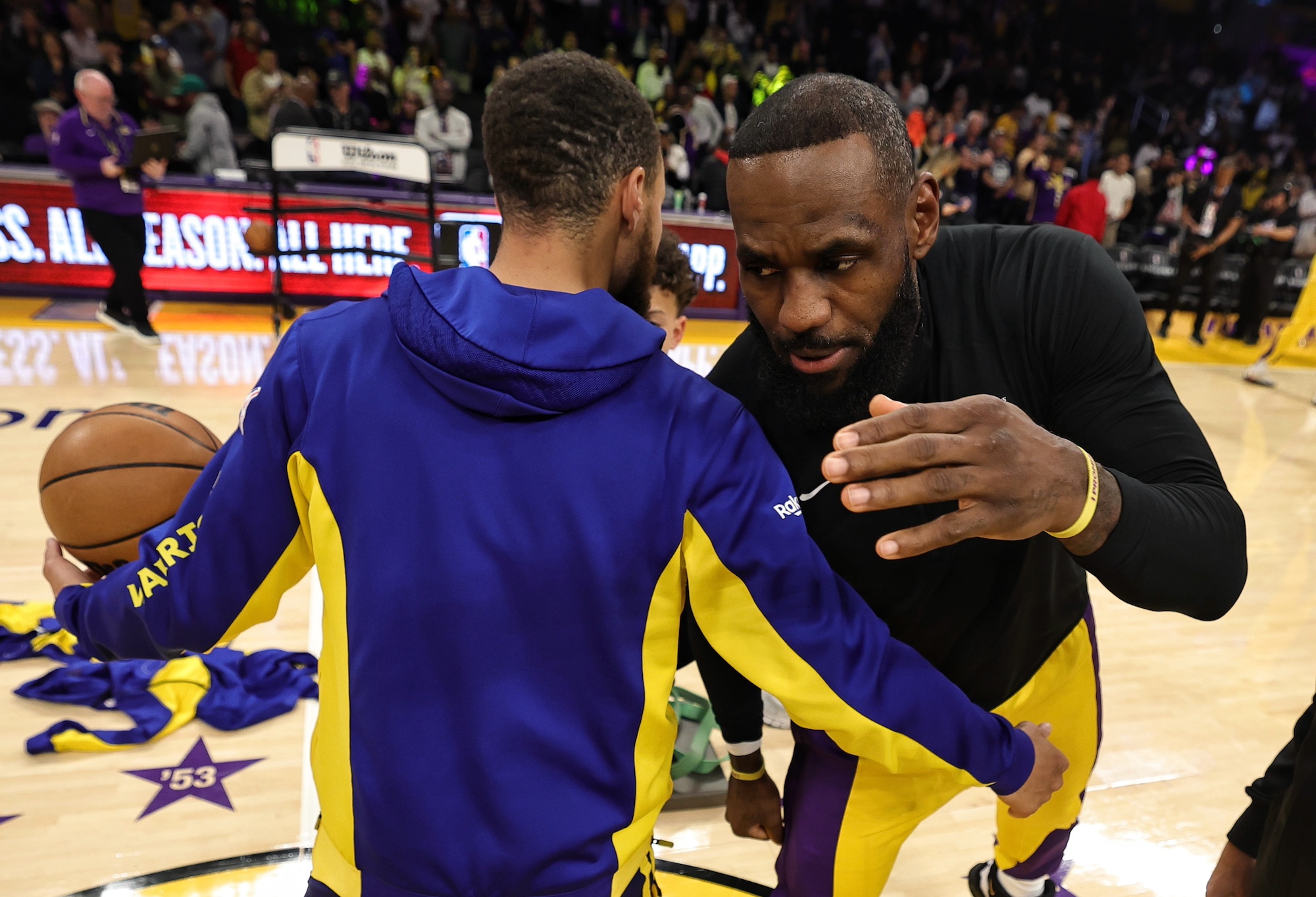 LOS ANGELES, CA - APRIL 9: Stephen Curry #30 of the Golden State Warriors &amp; LeBron James #23 of the Los Angeles Lakers embrace before the game on April 9, 2024 at Cryto.com Arena in Los Angeles, California. NOTE TO USER: User expressly acknowledges and agrees that, by downloading and/or using this photograph, user is consenting to the terms and conditions of the Getty Images License Agreement. Mandatory Copyright Notice: Copyright 2024 NBAE (Photo by Jim Poorten/NBAE via Getty Images)