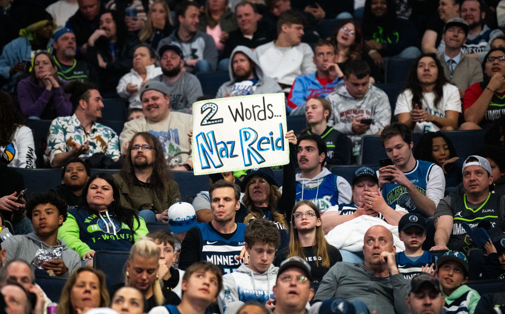 A fan holds up a sign for Naz Reid #11 of the Minnesota Timberwolves in the third quarter of the game against the Toronto Raptors at Target Center on April 3, 2024 in Minneapolis, Minnesota.