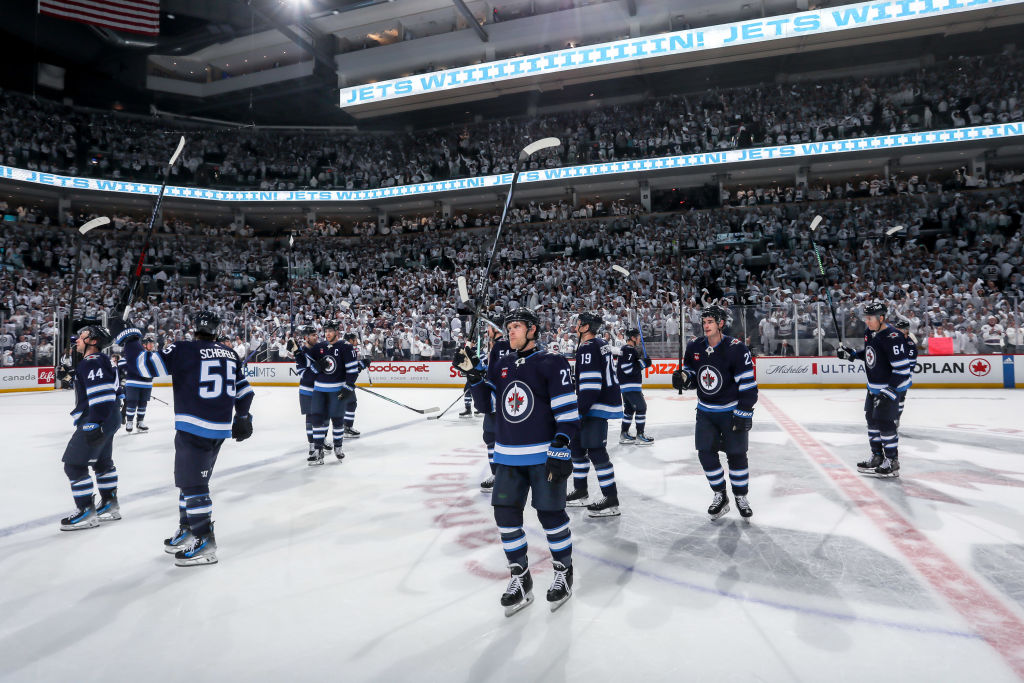 Winnipeg Jets players salute the fans after their win