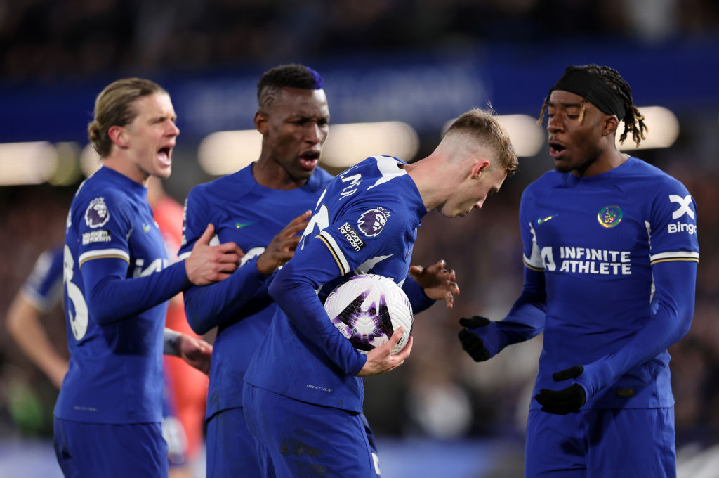 Noni Madueke of Chelsea argues with Cole Palmer of Chelsea of Chelsea about taking the penalty during the Premier League match between Chelsea FC and Everton FC at Stamford Bridge on April 15, 2024 in London, England.